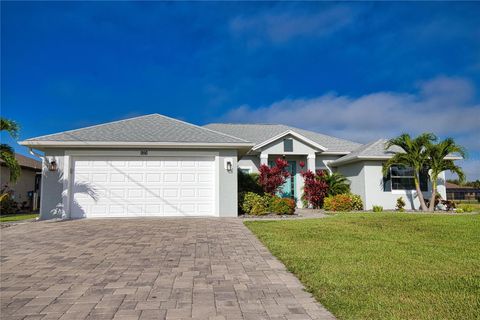 Photo of 916 Boundary Boulevard, Rotonda West, FL 33947 (MLS # O6399084)