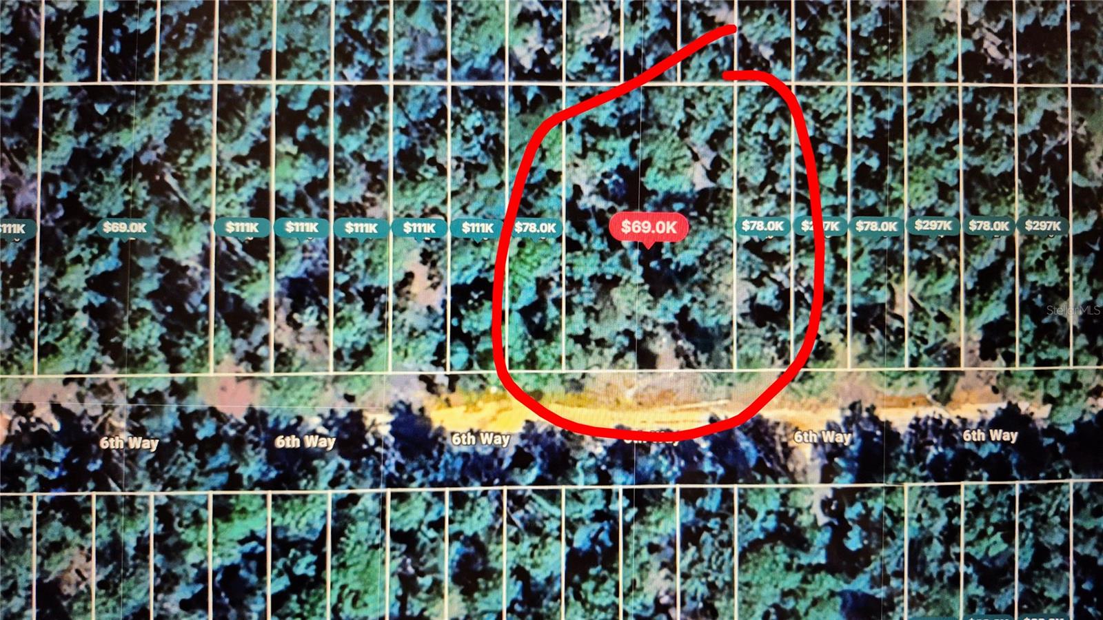 Double lot merged into one parcel, making this a spacious buildable homesite in a growing community. No HOA! Modular homes are accepted, giving you more options for building. Electricity is nearby and the property offers an excellent site for a builder or first-time home buyer. Just a short ride to the center of town for shopping, dining, and schools. Enjoy nearby lakes for fishing, boating, and outdoor activities. This land is priced to sell and can also be held for future profit. Great opportunity in the heart of Interlachen.