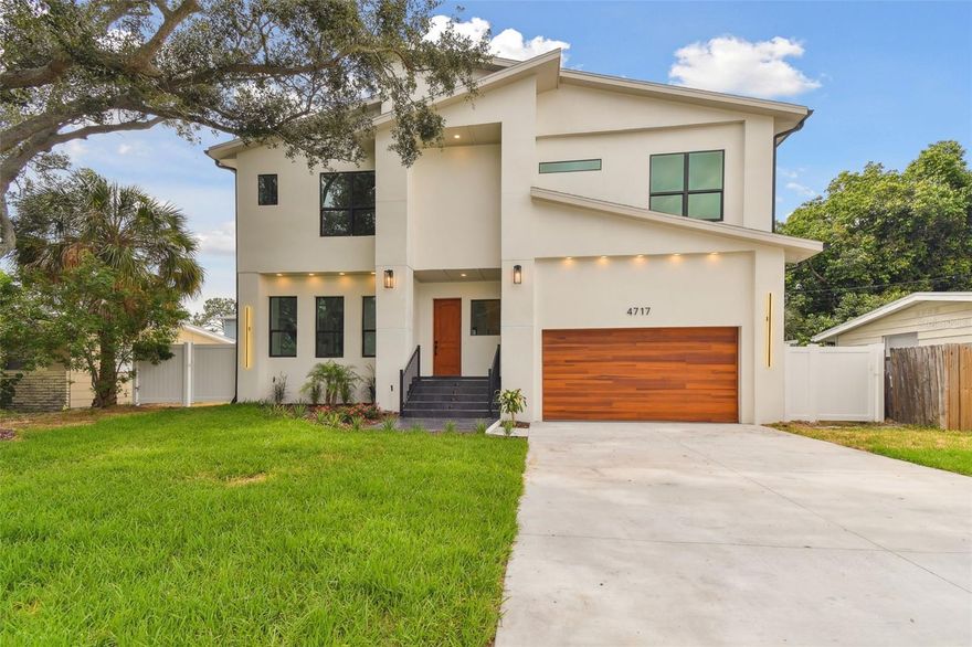 Introducing an exquisite and ready-to-move-in new construction property in the highly sought-after area of South Tampa. This stunning modern home is a true gem that stands out from the rest. Boasting 3,000 sqft of living space, this residence features 5 bedrooms and 4.5 bathrooms, providing ample room for comfortable living. This is not your typical cookie-cutter home built by a big builder. Step inside, and you will be greeted by high ceilings that create a sense of grandeur and elegance. The home is designed to maximize natural light with large hurricane-proof windows and sliding glass doors that have stackable panels. This allows light to flood the space, creating a bright and inviting atmosphere throughout. The kitchen is a chef's dream, equipped with top-of-the-line appliances and ample storage space to cater to all your culinary needs. Upstairs, the master bathroom is a true work of art, featuring luxurious fixtures and finishes. The shower-tub combo is designed with a seamless and open concept, adding a touch of sophistication. Each bathroom in the home is uniquely customized, adding a sense of individuality and personality to every space. Some standout features of this home include Low E-gas hurricane-rated windows and doors, a garage door opener with built-in Wi-Fi, Tesla Charger, camera, pot fillers, a custom range hood, and stackable sliding glass doors. The windows, doors, A/C units, water heater, and appliances all exceed energy efficiency ratings by Florida energy codes. This residence combines style, functionality, and exquisite craftsmanship, making it a one-of-a-kind property. You will have easy access to a wide array of amenities, including trendy shops, popular restaurants, and beautiful parks just minutes away. The home is conveniently located close to a community park and is just minutes away from picnic Island, beaches, and a golf course. If you enjoy waterfront dining, you will be pleased to know that popular restaurants like Hula Bay and The Salt Shack are just minutes away. The Marina District, with its shops and attractions, is also within proximity. Additionally, you will be just minutes away from the famous Bayshore Blvd, the airport, and all the amenities you desire. This home truly offers a combination of luxury, comfort, and convenience. Do not miss the opportunity to own this exceptional residence in South Tampa.