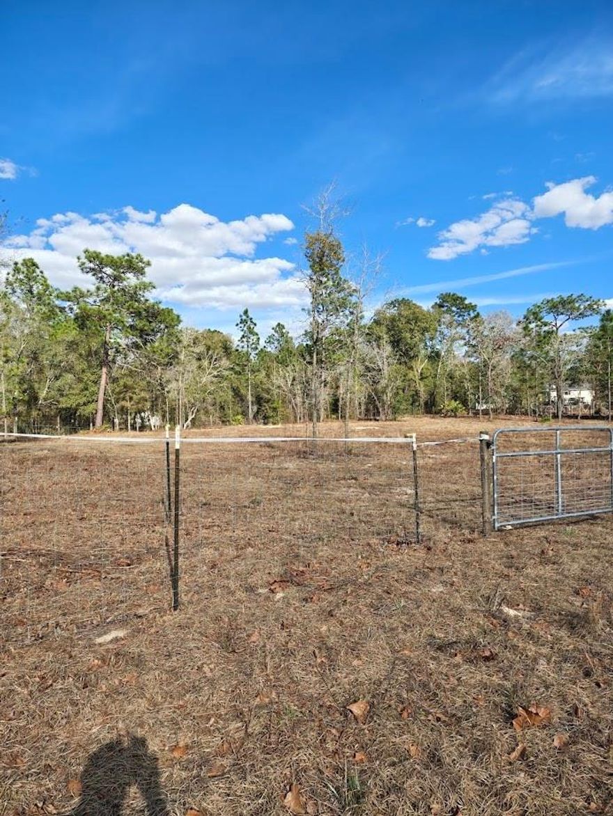 COME AND SEE THIS CLEARED 2.3 ACRE LOT THAT IS FENCED IN WITH ELECTRIC, WELL AND SEPTIC TANK. ALSO INCLOUDED IS A LARGE CAMPER THAT IS HOOKED UP AND READY TO LIVE IN AS YOU ARE BUILDING YOUR NEW HOME