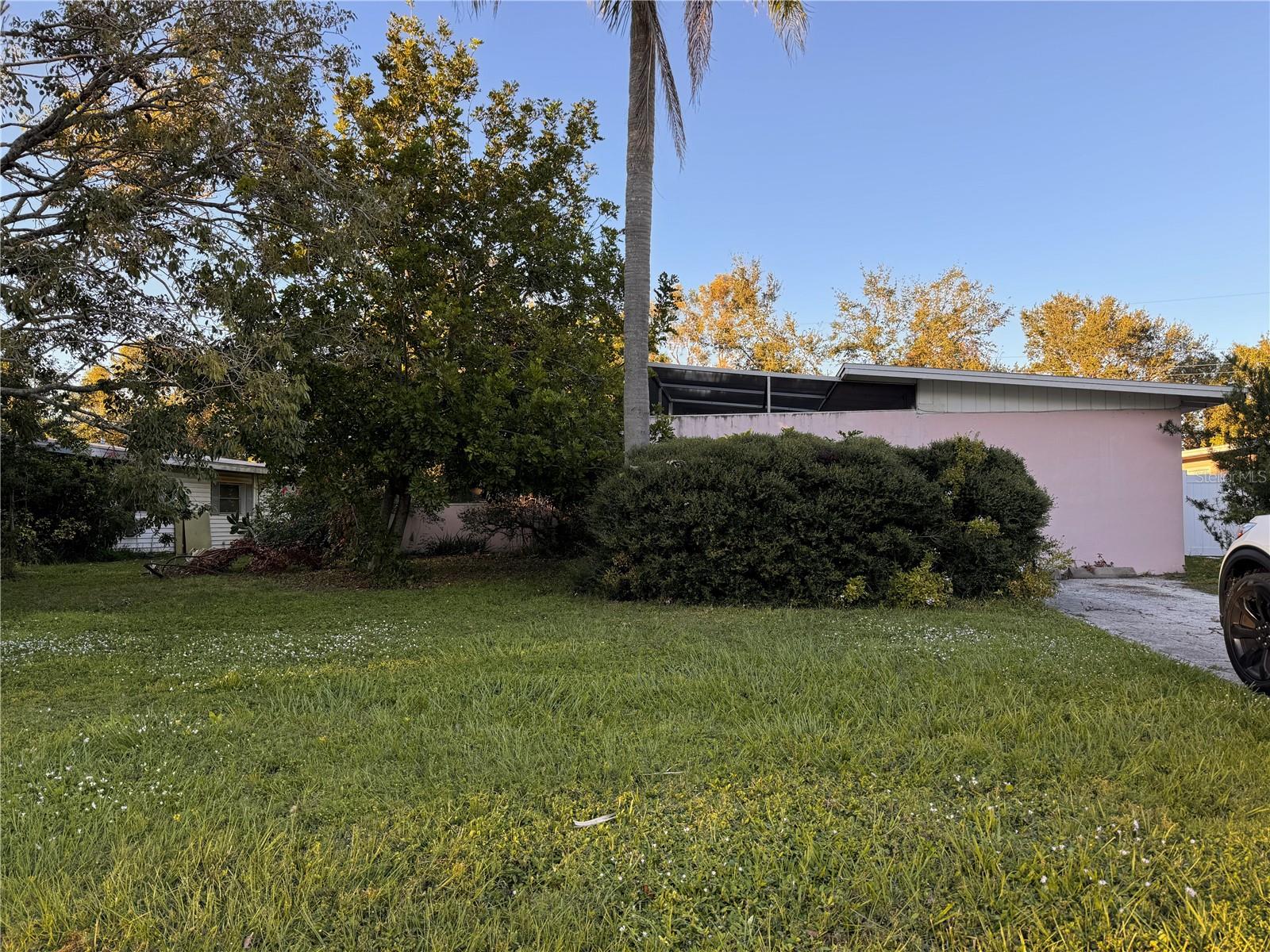 CALLING ALL INVESTORS! This 1,577 square foot home in the heart of the city of Sarasota, Florida offers a unique blend of POTENTIAL and PRIME LOCATION backing to the prestigious LEGACY TRAIL. This mid-century inspired design features Terrazzo flooring, VAULTED CEILINGS with Wood Beams, and a Courtyard perfect for creating your outdoor garden oasis. With 3 bedrooms and 2 bathrooms, Living and Dining Rooms, Galley Kitchen plus a BONUS Room, Walk In Closet, built in bookshelves and sliders to Courtyard area, this fixer-upper is perfect for those looking to restore this GEM to its fullest potential! One of the key highlights is its LOCATION, with your backyard overlooking the Legacy Trail, making it ideal for outdoor enthusiasts and cyclists. Additionally, it's only 5 miles away from the vibrant St. Armands Circle and the beautiful Lido Key, providing easy access to upscale boutiques, award-winning restaurants, posh art galleries, and pristine Gulf beaches. This home presents a fantastic opportunity to invest in a highly desirable area, combining the best of Sarasota's natural beauty, historic Ringling district, Payne Park, and urban conveniences. Whether you're looking to renovate for personal use or as an investment, this property has unlimited possibilities. The Permits show ROOF was redone in 2013, HVAC 2012. It is FEMA zoned X which means no Flood Insurance is required. With NO HOA fees or deed restrictions and located in a desirable rental area, this property holds remarkable potential as an income producing asset. Seller says there was no flooding, nor any water intrusion after the 2024 storm. DON'T WAIT ~ Call for your showing today!