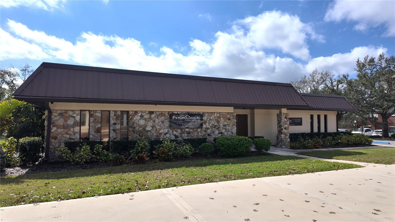 Prime Downtown Clermont Location with opportunity to Develop on a 15,000 sf lot. This professional building in turn-key condition is offered for sale in Historic Downtown Clermont adjacent to City Hall. Zoning allows for development all the way to the lot lines with opportunity to expand upward to 50ft. high with additional floors. With 150 feet of frontage on Montrose Street directly across from the Clermont City Center, and 100 feet of shared boundary line with City Hall, this property is positioned for high visibility in a business friendly setting. Formerly a doctor's office and accountant's office, this property is now home to a highly successful psychology practice, where psychological testing, counseling, therapy, research, writing, and instruction are provided. The facility boasts 3,259 square feet of professional space, including three bathrooms, two kitchenettes, two reception areas, as well as various offices and meeting rooms. The property is beautifully landscaped and features brick-pavered walkways, a pergola, and ample parking options, including eight paved spaces, four street parking spaces in front of the building, and two additional spaces beside it. Schedule your showing today!