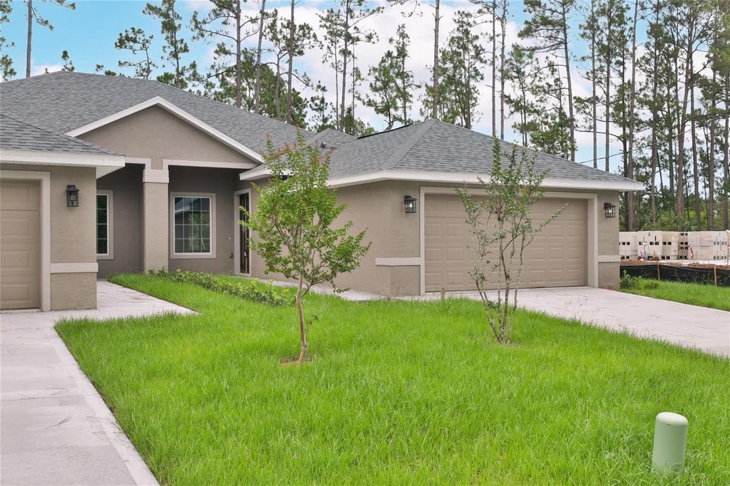 Photo of 51 Providence Lane #A, B, Palm Coast, FL 32164 (MLS # FC321745)