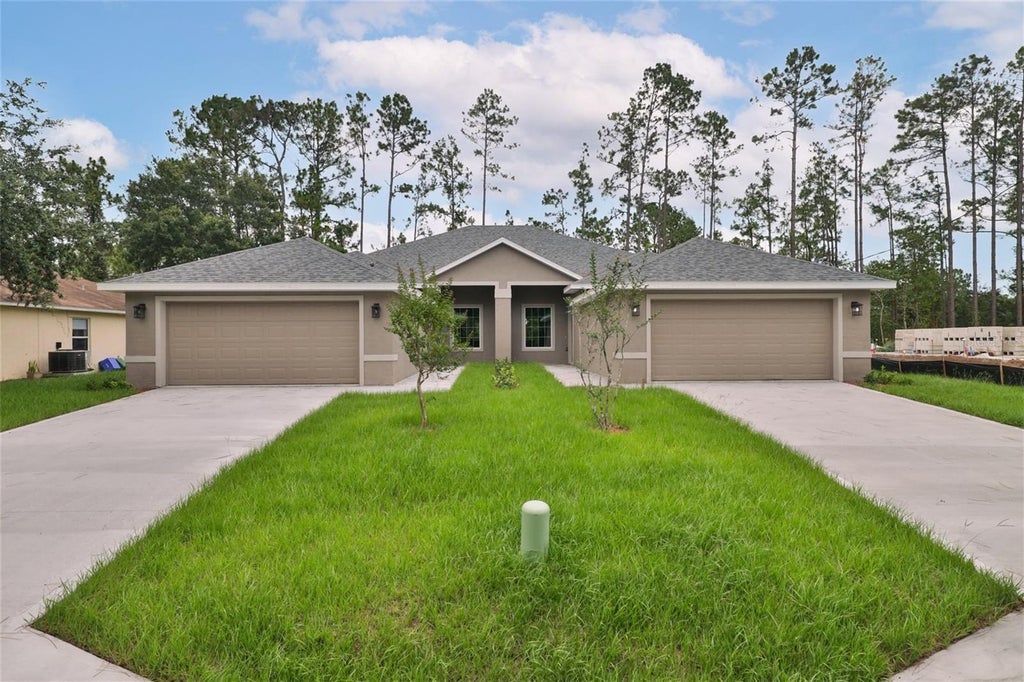 Photo of 51 Providence Lane #A, B, Palm Coast, FL 32164 (MLS # FC321745)
