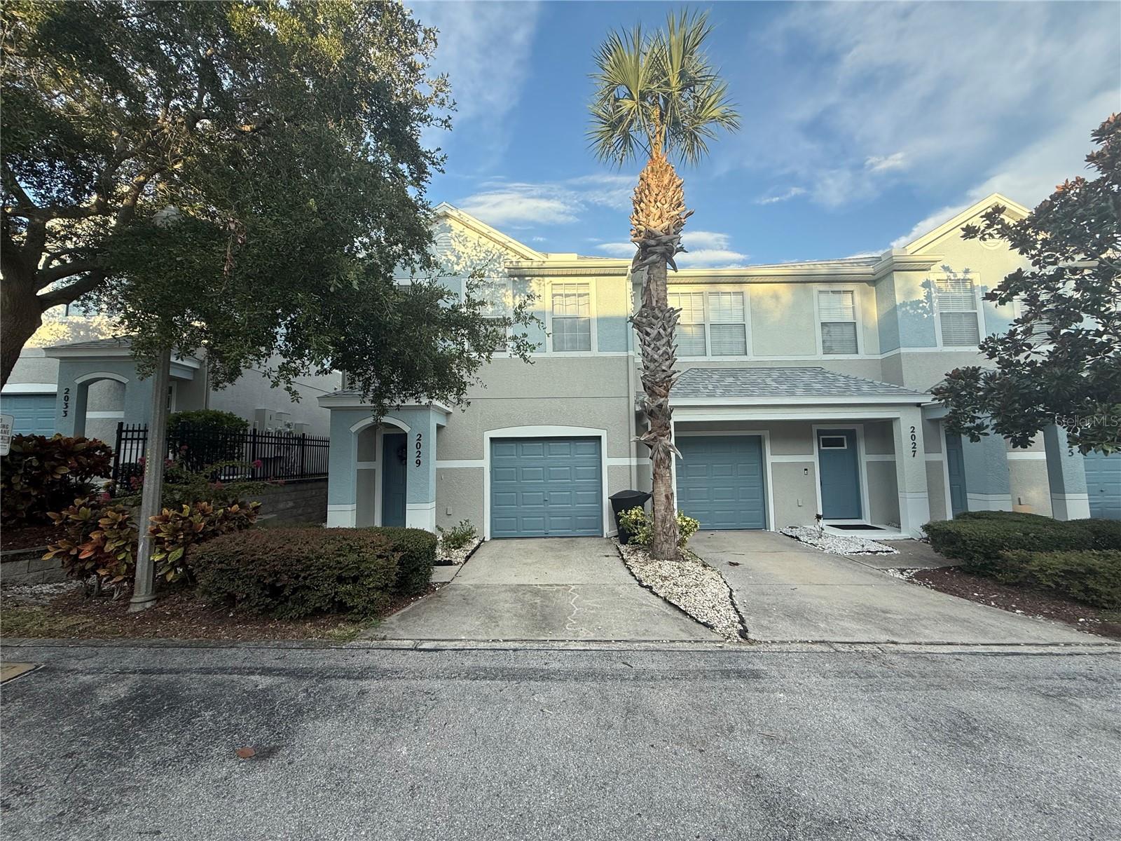 WELCOME HOME! Make an appt to see this one quickly! Beautifully finished 3 bed / 2.5 bath END-UNIT TOWNHOME on the border of Clearwater/Dunedin! Buyers will love the vaulted 10 ft. ceilings (both downstairs & upstairs) and wonderful natural light flowing throughout. Enter the home in the foyer and proceed down the hall to the Dining/Kitchen/Living Room Combo. The Extra Windows on the End-Unit make this LIGHT & BRIGHT and an inviting space to host/entertain! The attention to detail is spectacular, including the downstairs Half Bath featuring CUSTOM TRIM/WAINSCOTING DETAILS. This home offers upgrades including custom staircase & entire second floor has Luxury Vinyl plank flooring. 3 bedrooms and 2 full bathrooms upstairs. The generous sized Primary Suite offers En-suite bathroom, Double Vanity sinks, Garden Tub, Stand-up shower area and Large Walk-in Closet. The 2 additional rooms upstairs are currently used as a Guest Room and Office. Additional features include: Freshly Painted Exterior / Interior. Custom Wood work/ trim. Newer Roof (March 2024), Low Monthly HOA fee covers all exterior maintenance, Flood zone X. Close proximity to downtown Clearwater, Dunedin, the Pinellas Trail and 15 min to Clearwater Beach! Zoned for excellent local schools and private/charter options. Home includes Aluminum Hurricane Shutters. This beautiful townhome is turnkey and ready to go for the next homeowner!