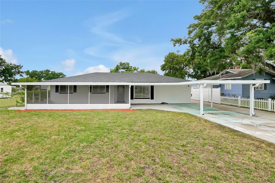 Welcome to your turn-key Florida retreat! This beautifully reimagined home is a masterclass in modern updates and serene living, nestled within a tranquil, established community. From the moment you arrive, the vibrant curb appeal and crisp, clean lines signal a home that has been maintained with pride. The heart of the residence is an open, sun-drenched kitchen featuring premium stainless-steel appliances, sleek cabinetry, and chic subway tiling—perfect for the culinary enthusiast or the frequent entertainer. With durable wood-look flooring and a versatile, oversized utility suite, this home seamlessly blends style with everyday functionality.

Beyond the interior, your private oasis awaits. Relax on the expansive screened-in porch or take advantage of the massive, fully fenced backyard—a rare find that offers limitless potential for a pool, garden, or workshop. The long driveway and integrated carport provide plenty of space for your vehicles and toys, making this the perfect home base for a Central Florida lifestyle. Whether you’re a first-time buyer or a savvy investor looking for a high-quality asset, this property offers an optimistic outlook and incredible value. Opportunity is knocking—book your showing today and claim your piece of paradise!