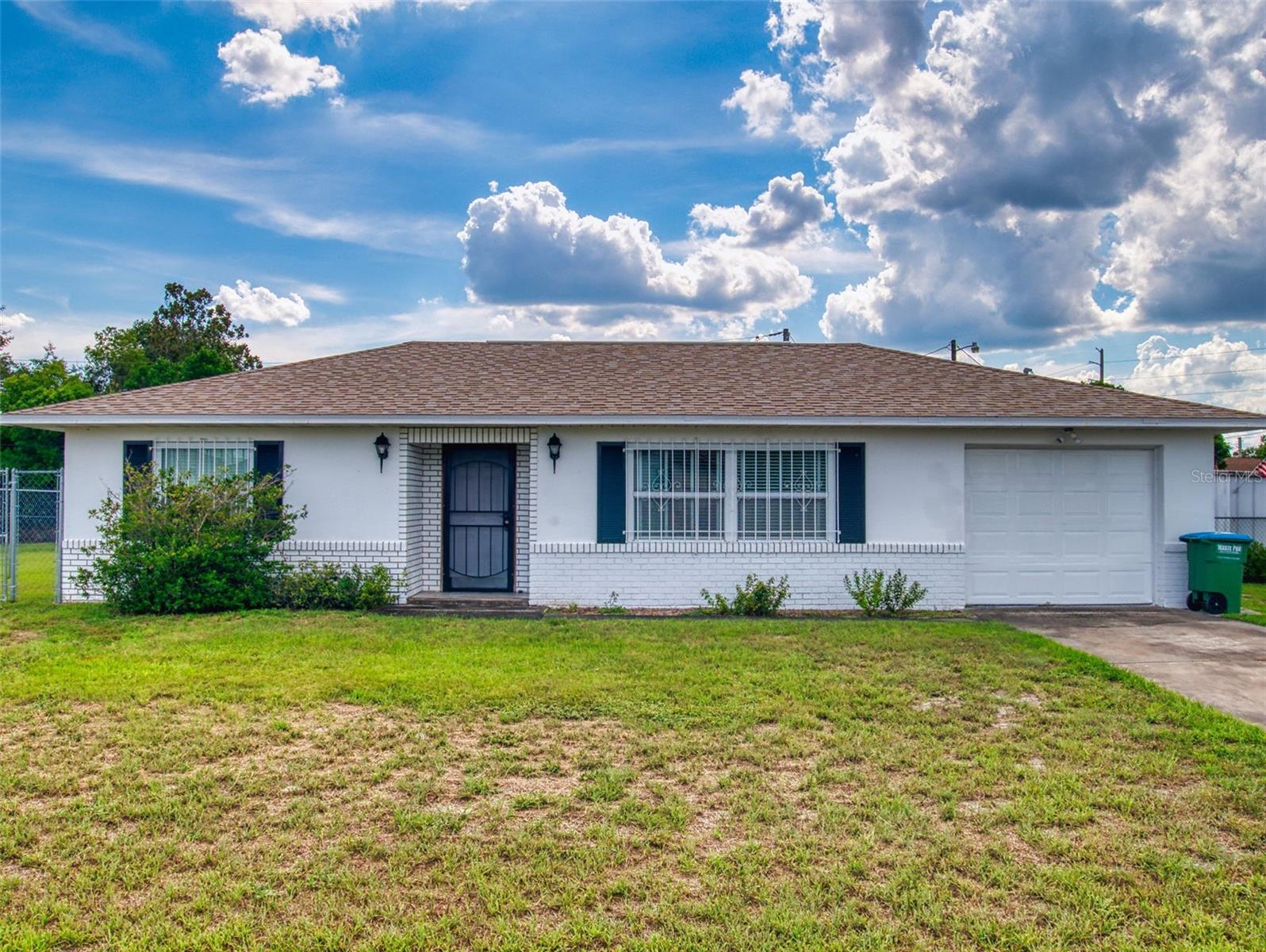 EXTREMELY WELL-KEPT HOME ON A HIGH AND DRY FENCED LOT THAT IS CLOSE TO SHOPPING AND ONLY MINUTES TO I-4, THE ORLANDO METRO AREA AND THE BEACHES. NO CARPET INSIDE THIS ONE...ALL CERAMIC TILE AND WOOD LAMINATE FLOORING THROUGHOUT. INCLUDES A BRAND NEW ROOF...THE A/C WAS REPLACED IN 2019... THE HOT WATER HEATER IS ONLY ONE YEAR OLD... NEWER ENERGY EFFICIENT WINDOWS...ALL THE KITCHEN APPLIANCES ARE LESS THAN 5 YEARS OLD...AND THE WASHER AND DRYER ARE NEWER AS WELL! NICE SIZED 2 BEDROOM HOME WITH A EAT-IN KITCHEN WITH PLENTY OF CUPBOARD AND COUNTER SPACE, A SEPERATE DINING AREA, AND A HUGE 20X12 REAR SCREENED REAR PORCH OVERLOOKING THE SPACIOUS FENCED BACKYARD. THE GARAGE IS ALSO AIR CONDITIONED (NOT INCLUDED IN QUOTED THE HEATED/COOLED SQUARE FOOTAGE), AND HAS VINYL FLOORING AND CAN BE USED AS ADDITIONAL LIVING SPACE. THIS IS A TURN-KEY HOME WITH HANDICAP ACCESSIBLE FEATURES AND IS READY FOR IMMEDIATE OCCUPANCY!