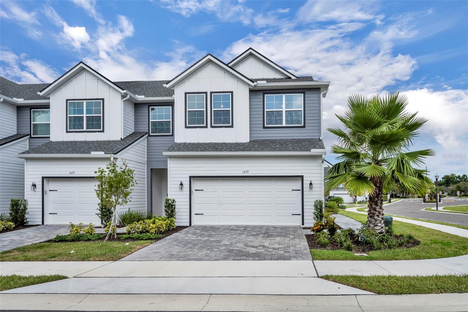 This beautiful end-unit townhome offers all the perks of new construction, plus upgrades, finishes, and details you won’t find in a builder’s model.
With 3 spacious bedrooms, 2.5 bathrooms, a flexible loft, and nearly 2,000 square feet of open living space, there’s plenty of room to relax, work, and entertain.
The kitchen is a standout with quartz countertops, 42-inch cabinets, stainless steel appliances, a walk-in pantry, and a large island that opens to the main living and dining areas.
Step outside to your screened-in lanai, complete with weather shades, and enjoy a brand new fenced-in yard with turf and an extended paver patio. It is perfect for morning coffee, weekend grilling, or relaxing in any weather. A private gate gives you direct access to the community pool just a few steps away.
Upstairs, you’ll find all three bedrooms, a laundry room for convenience, and a cozy loft. The owner’s suite is located at the back of the home with peaceful pool views, a spacious walk-in closet, and a double vanity with quartz counters. Additional features include epoxy-coated garage flooring, ceiling fans in every bedroom, added gutters, and extra natural light thanks to the end-unit location.
Move-in ready and complete with a one-year home warranty for peace of mind. If you want style, function, and one of the best locations in the community, you’ll want to see this one. The seller’s preferred lender is also offering a 1-0 buy-down to make your first year even more affordable.