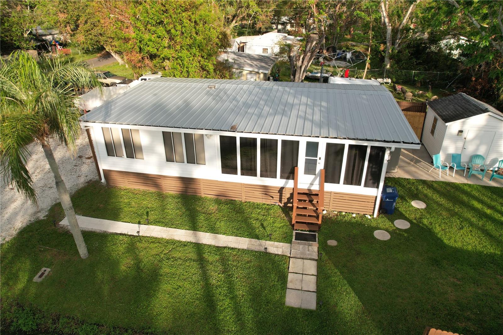 Welcome to this beautifully updated 2-bedroom, 1-bathroom modular home, currently operating as a successful Airbnb, making it a fantastic investment opportunity or a cozy residence! Located just 10 minutes from the beautiful Nokomis Beach and North Jetty, this home offers easy access to I-75 (5 minutes) and the new Venice Campus of Sarasota Memorial Hospital (also 5 minutes away). The home has been tastefully refreshed with new paint (2023) and brand new flooring (2024). Major updates include a new HVAC system (2023), a new roof (2023), and a water heater (2022), ensuring reliable, worry-free living. The bathroom received a full remodel in 2023, featuring a new shower, toilet, vanity, sink, and flooring. The kitchen, upgraded in 2022, boasts new cabinets, a modern sink, and a refrigerator, offering functionality and style. Additionally, this property is equipped with a new 50-amp service RV hookup and a minimalist HVAC addition (2023), enhancing comfort and utility. With city water service and a private septic tank, this home offers convenience and independence. Move-in ready and income-generating, this property is perfect for investors and those seeking a beach-adjacent lifestyle in a prime location!