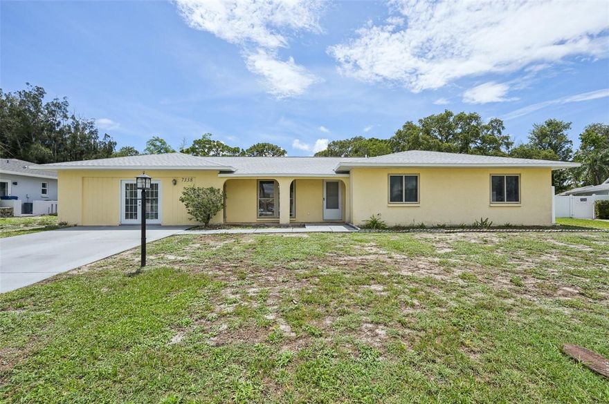 Welcome to this comfortable home in a convenient Whitfield location. This 3-bedroom, 2-bathroom house offers nearly 2,000 sq. ft. of open living space with tile floors throughout, making it ideal for a growing family. The kitchen, equipped with stainless steel appliances, a breakfast bar, and wood cabinets, opens into the living area, perfect for everyday living and entertaining. The primary bedroom features an en suite bathroom for added convenience, and all bedrooms are generously sized. You'll also find an extra-large bonus room, providing additional space for a variety of uses. There’s a large laundry room with plenty of storage. The home includes new solar panels installed and paid off in 2022, a new roof installed in April 2024, and a new vinyl fence installed in 2023. Located in a peaceful neighborhood near downtown Sarasota, you’ll be close to shopping, restaurants, the interstate, and a park with picnic tables and a green area. The house is also near Sara Bay Marina and offers a quick commute to SRQ airport. Enjoy the nearby Sarasota Bay, Ringling Museum, Van Wezel, Siesta Key beaches, Selby Gardens, and St. Armand’s Circle. This home is ready for you to move in and make it your own. Seller is offering a credit at closing for the future home owner to have the exterior of the home painted as well as a credit for landscaping with an accepted contract.