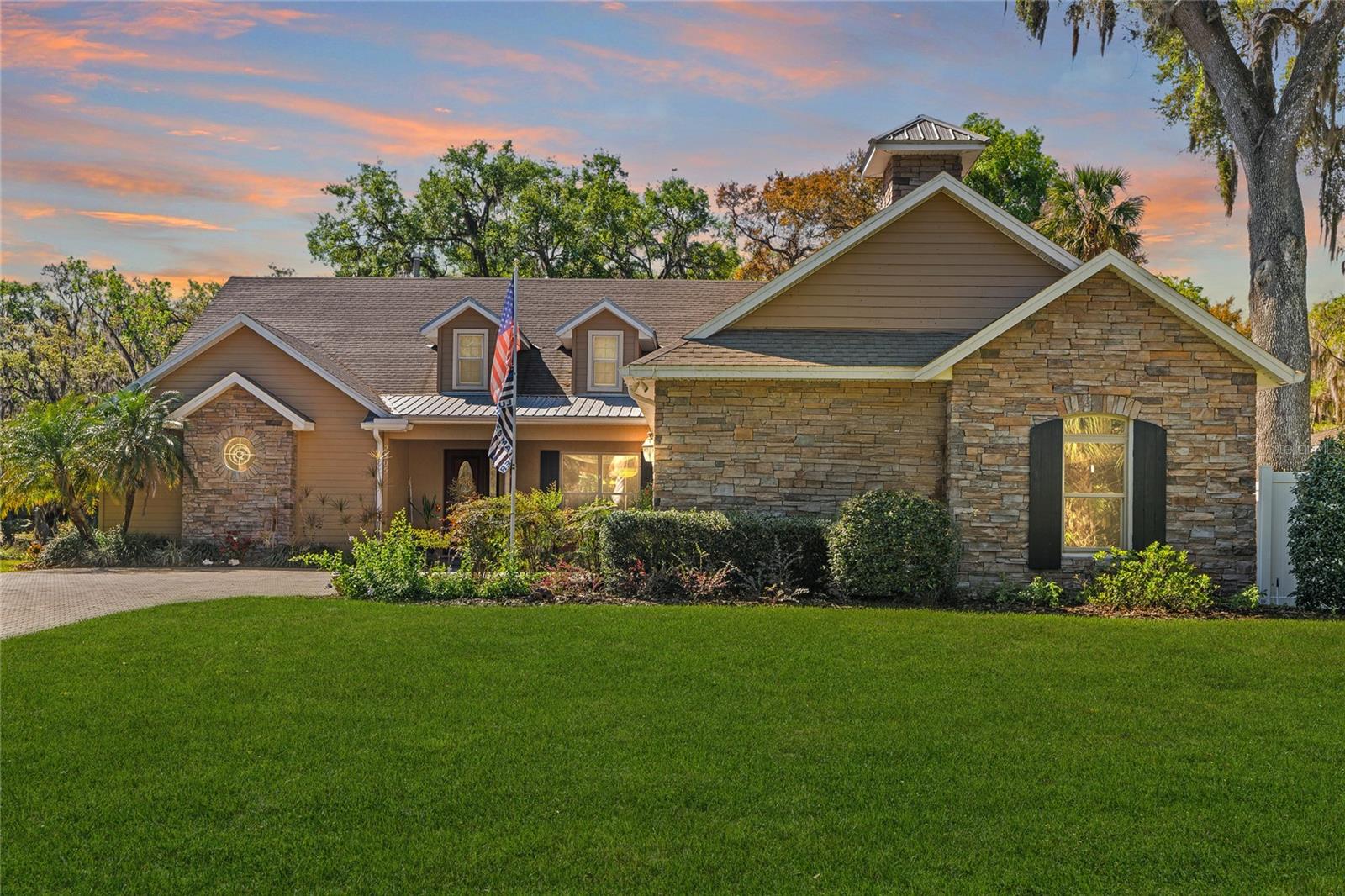 NEW ROOF coming soon! Welcome to your dream home just minutes down stream from the St. John’s River! This stunning custom-built waterfront retreat offers just under 3,300 sq. ft. of upscale living space with breathtaking views and direct access to the Intracoastal Waterway—perfect for boating enthusiasts. Positioned high and dry, this home has never flooded. Featuring 3 spacious bedrooms, 3 full bathrooms, and an oversized 3-car garage, it blends luxury, comfort, and functionality. Inside, soaring 20’ ceilings and elegant finishes create a grand first impression. The open floor plan includes a formal dining room with double-tray ceilings and crown molding, and a chef’s kitchen with 2024 stainless steel appliances, granite countertops, abundant cabinetry, breakfast bar, and a dinette framed by bay windows overlooking the pool. The expansive master suite offers a gas fireplace and sliding doors leading to the 1,300 sq. ft. screened lanai and pool area. The spa-style master bath features dual vanities, walk-in closets, a large walk-in shower, and a soaking tub. The generous guest bedrooms are separated for privacy in this true split floor plan. A versatile game room includes a full bath, double-sided fireplace, and wet bar—ideal as an in-law suite. Premium upgrades include paid-off solar panels for low energy costs (just $33 for the month of September), 2019 HVAC, 2024 impact-resistant windows, 2024 whole-home generator, tankless water heater, central vacuum, updated gas pool/spa heater, and new pool pump. With a brand new roof on it's way, ALL bases are covered for worry-free living! Perfect for entertaining inside and out, this home offers the ultimate Florida waterfront lifestyle. Schedule your private showing today!