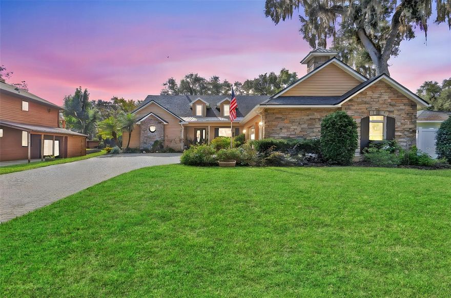 NEW ROOF coming soon! Welcome to your dream home just minutes down stream from the St. John’s River! This stunning custom-built waterfront retreat offers just under 3,300 sq. ft. of upscale living space with breathtaking views and direct access to the Intracoastal Waterway—perfect for boating enthusiasts. Positioned high and dry, this home has never flooded. Featuring 3 spacious bedrooms, 3 full bathrooms, and an oversized 3-car garage, it blends luxury, comfort, and functionality. Inside, soaring 20’ ceilings and elegant finishes create a grand first impression. The open floor plan includes a formal dining room with double-tray ceilings and crown molding, and a chef’s kitchen with 2024 stainless steel appliances, granite countertops, abundant cabinetry, breakfast bar, and a dinette framed by bay windows overlooking the pool. The expansive master suite offers a gas fireplace and sliding doors leading to the 1,300 sq. ft. screened lanai and pool area. The spa-style master bath features dual vanities, walk-in closets, a large walk-in shower, and a soaking tub. The generous guest bedrooms are separated for privacy in this true split floor plan. A versatile game room includes a full bath, double-sided fireplace, and wet bar—ideal as an in-law suite. Premium upgrades include paid-off solar panels for low energy costs (just $33 for the month of September), 2019 HVAC, 2024 impact-resistant windows, 2024 whole-home generator, tankless water heater, central vacuum, updated gas pool/spa heater, and new pool pump. With a brand new roof on it's way, ALL bases are covered for worry-free living! Perfect for entertaining inside and out, this home offers the ultimate Florida waterfront lifestyle. Schedule your private showing today!