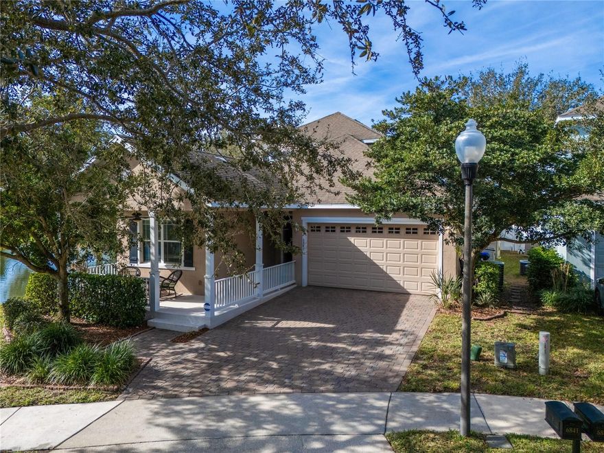 Nestled within the highly desirable Preston Square community, this elegant four-bedroom, three-bathroom pool home showcases serene pond and conservation views, offering both privacy and picturesque surroundings. A paver driveway and charming covered front porch create a warm and welcoming first impression. Step inside to high ceilings, abundant natural light, and tile flooring throughout the main living areas. Crown molding enhances the refined atmosphere, while the spacious living and dining areas provide an ideal setting for everyday living and effortless entertaining. The open-concept kitchen is thoughtfully designed to flow seamlessly into the living spaces, making it the heart of the home. Highlights include a center island with bar seating, granite countertops, rich wood cabinetry with crown molding, a stylish backsplash, and a sunlit breakfast nook—perfect for casual meals or morning coffee. The primary suite is a true retreat, featuring wood flooring, a tray ceiling with crown molding, a ceiling fan, and dual closets. The spa-inspired en-suite bath offers dual vanities with granite countertops, a relaxing soaking tub, and a walk-in tiled shower with a glass enclosure. Two additional bedrooms on the main level feature wood flooring and ceiling fans and share a well-appointed secondary bath with granite vanity and a tiled tub/shower combination. Upstairs, a spacious bonus room provides endless possibilities as a media room, game room, or secondary family room. A generously sized fourth bedroom and a third full bath—complete with granite vanity and tiled tub/shower—complete the upper level. Sliding glass doors lead to a private outdoor oasis featuring a pavered lanai and a screen-enclosed pool, ideal for enjoying Florida’s sunshine or relaxing while taking in the tranquil water and conservation views. Perfectly situated in one of Windermere’s most sought-after communities with top-rated “A” schools, residents enjoy access to exclusive amenities including a clubhouse, community pool, playground, and sports court. As an added bonus, Disney fireworks can be enjoyed from the comfort of your own backyard. Conveniently located near premier shopping, dining, and entertainment, this exceptional home offers the perfect blend of luxury, comfort, and lifestyle—an ideal place to call home in Windermere.