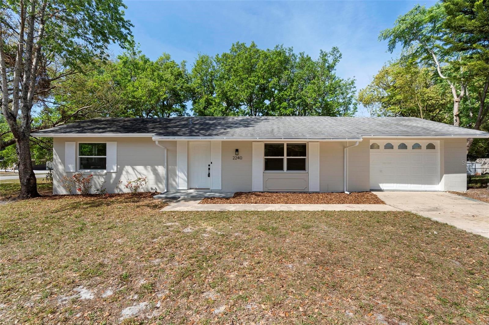 What a cute and quaint, bungalow on a large, oversized corner lot in a great neighborhood. Step into this totally renovated 2 bedroom, 1.5 bath home with an expansive one car garage. Done the right way with quality workmanship, materials, fixtures, appliances, BRAND NEW A/C and tankless gas hot water heater. From the custom backsplash in the kitchen, recessed lighting, attractive bath fixtures, to the gorgeous chandelier and remote-control light fans, this home is inviting and fresh. RARE BONUS FOR THE AREA: **Laundry Room** (washer and dryer in place, usually in garage). Great yard with storage shed and a big, big patio outback surrounded by nice and mature trees, plants and bamboo. Come see everything Volusia County and the surrounding areas have to share to create your piece of peace. There is so much to do and see here in Central Florida. Contact me today for your private showing. At this rental price point and the beauty of this home and property, it will not last long! NO SMOKING!!! 1 pet to owner discretion with $500 pet deposit. Move in cost is the 1st month's rent of $1800 and 1.5 times the rent deposit $2700. Total move in $4500! $50 Application Fee