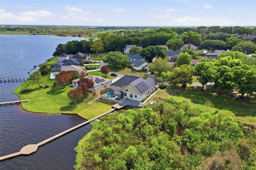 Welcome to your slice of LAKEFRONT, POOL HOME paradise on the pristine shores of Lake Mariam in Winter Haven, Florida. This stunning 3-bedroom, 2.5-bathroom home with a versatile BONUS ROOM offers the ultimate Florida lifestyle, complete with direct lake access, a private  dock, and breathtaking water views right from your own backyard.

Built to last and designed for low maintenance, this home features a durable METAL ROOF and solar panels, offering peace of mind and significant savings on energy costs year after year. Whether you’re sipping morning coffee while watching the sunrise over Lake Mariam or heading out for a day on the water, this property delivers the lakefront living experience you’ve been searching for.

Inside, the thoughtfully designed floor plan offers three comfortable bedrooms, two and a half bathrooms, and a spacious bonus room perfect for a home office, media room, guest suite, or playroom. The heart of the home is the beautifully designed kitchen, featuring abundant cabinetry, stainless steel appliances, granite countertops, a center island, breakfast bar seating, glass-front upper cabinets, recessed lighting, and an open layout that flows seamlessly into the main living areas. With its generous workspace and water views from the adjoining living space, this kitchen is ideal for both everyday living and entertaining.

The oversized 2-car garage provides ample storage for vehicles, watercraft equipment, and all your lake toys. Step outside and discover what truly sets this property apart: your own private HEATED POOL and SPA, along with an impressive  private dock stretching out over the serene waters of Lake Mariam, ideal for boating, fishing, kayaking, or simply soaking in the natural Florida scenery. With direct lake access and one of the longest docks on the water, this is a rare find in today’s market.

Located in Winter Haven’s sought-after lake corridor, you’re just minutes from dining, shopping, Legoland Florida, and easy access to I-4 connecting you to both Tampa and Orlando. Schedule your showing today!