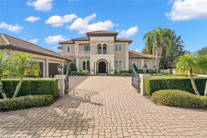 12205 Broadwater Loop. Imagined and built in 2008 by Tampa's most prestigious builder: Alvarez Homes. This Mediterranean beauty is located in Stonelake Ranch: a 680-acre master-planned equestrian community that boasts privacy, prestige & security. No rear neighbors, 1.8 acres of land, and 170 feet of water frontage with access to Lake Thonotosassa: the dock comes equipped with a 10,000 pound boat lift & 2 jet ski lifts. Every sense is captivated with the prominent entrance to the home: an access bridge...a long winding driveway... a courtyard with extra parking and a private gate for a grand entry. Beautiful wooden double doors take you to your 2-story foyer, with immediate views of the stately formal sitting room and formal dining room upon entering the home. The master suite and executive office are conveniently located on the east-wing of the home. If you are looking for a retreat from life's anxieties: look no further. The master suite is serene, with vaulted ceilings, crown moulding, its own sitting area with a fireplace and views of the extensive backyard. The master bathroom has two vanities, and custom cabinetry from floor to ceiling. Inside the master bathroom is an extra room that would make an excellent nursery, home office, or additional closet. But the ultimate surprise is the magnificent master closet: with two islands, custom cabinetry, rope molding, and enough space for even the most extensive shoe, purse, and clothing collections. On the west wing of the home is a grand chef's kitchen with subzero fridge, built-in range hood, and oversized island. The kitchen is open to the spacious family room, with plentiful natural light creating the perfect haven for entertaining guests. And speaking of entertainment, what better way to "dive" into the Florida lifestyle than enjoying the indoor-outdoor connection via the doors to covered rear patio from the family room. The backyard boasts a huge pool, covered gazebo, outdoor kitchen, and lots of green space that leads up the dock & waterfront. Also downstairs is a spacious guest bedroom with en-suite bathroom. The first floor is a home unto itself, and the second floor provides even more amenities: three bedrooms with en-suite bathrooms (two of which have their own balconies), and a HUGE 22X20 BONUS room with an oversized balcony that boasts views of the LAKE. Equipped with a wet bar & wine cooler, the bonus room offers flexible options for entertainment and would make a great THEATER/MEDIA center. The home is a short drive to downtown Tampa, Tampa International airport, major hospitals including TGH, Moffitt & Lakeland Regional. Quick access to interstates I-4 & I-75, shopping & all that the Tampa has to offer. Do not miss this opportunity to secure a one of a kind estate, and to make the kind of memories that last a lifetime. 3d tour and floorplan available upon request.