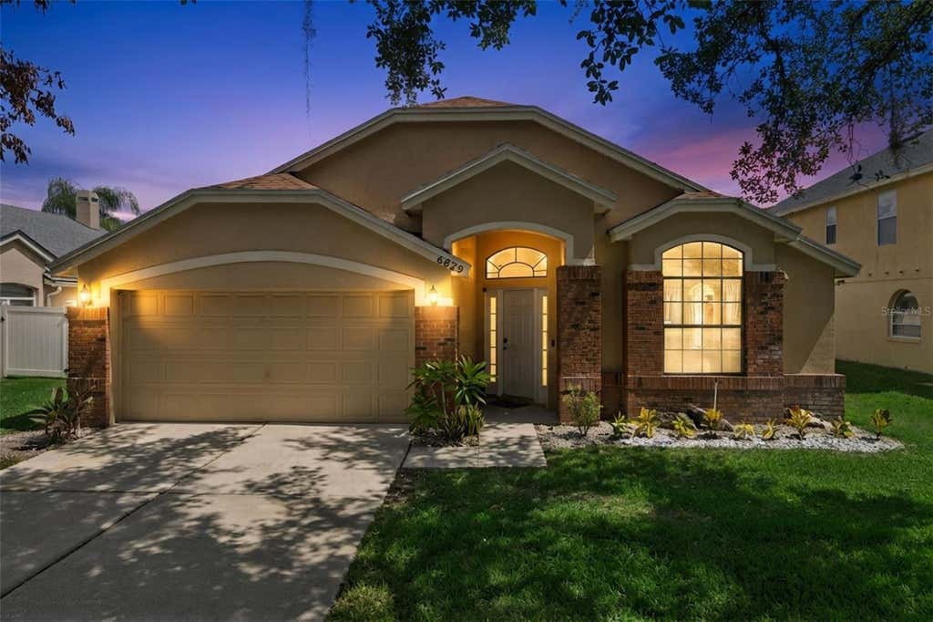 Photo of 6629 Winder Oaks Boulevard, Orlando, FL 32819 (MLS # O6426762)