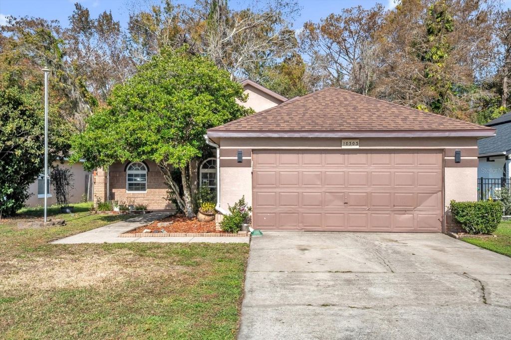 Photo of 10303 Winding Creek Lane, Orlando, FL 32825 (MLS # O6372632)