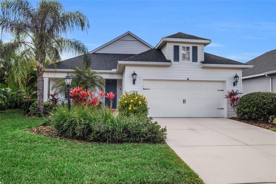 Location, location, location! Welcome to 7798 Ridgelake Circle, where convenience meets comfort just minutes from everything you could possibly need—from Lakewood Ranch and University Town Center to top-rated schools, shopping, dining, I-75, golf courses, and the world-renowned Gulf Coast beaches. This beautifully maintained, move-in ready residence is located in the gated, pet-friendly community of The Ridge at Crossing Creek in Bradenton, Florida, and was built by Neal Communities, a highly respected builder known for quality construction and thoughtful design. The home offers the perfect combination of modern style, everyday comfort, and an unbeatable central location in one of the area’s most desirable amenity-rich neighborhoods.

Perfectly positioned on a desirable corner lot with added privacy, this newer home offers an inviting blend of modern architecture and functional living spaces. From the moment you arrive, the home’s charming coastal curb appeal and manicured landscaping create a warm first impression. Inside, an open split-bedroom floor plan with soaring ceilings fills the home with natural light while creating comfortable gathering spaces and private retreats for family and guests. The living room is enhanced by beautiful coffered ceilings, adding architectural character and an elevated feel to the main living area.

At the heart of the home, the modern kitchen serves as a stunning centerpiece, featuring a large island ideal for entertaining, beautiful white cabinetry, sleek countertops, and an upgraded stainless steel appliance package that includes a new dishwasher. The kitchen flows effortlessly into the dining and living areas, creating the perfect layout for hosting gatherings or enjoying everyday living. A thoughtful custom barn door addition leading to the den, cut through from the custom butler’s pantry, adds both functionality and design appeal—making the den an ideal home office, flex space, or quiet retreat.

The spacious primary suite offers a relaxing private sanctuary with large windows, generous closet space, and a well-appointed ensuite bathroom featuring dual vanities and a walk-in shower. Additional guest bedrooms are thoughtfully positioned within the split floor plan to provide privacy for family members and visitors.

One of the standout features of the home is the screened-in lanai overlooking the expansive fenced backyard, providing a peaceful outdoor space for relaxing mornings, entertaining guests, or enjoying time with pets. The recently added fence enhances privacy and functionality, while automatic blinds on the sliding glass doors add both convenience and modern comfort. The oversized yard and corner lot create a rare sense of space within a community setting.

Additional updates include a new washing machine, new washer and a tesla hookup in the garage ensuring the home is truly move-in ready and well maintained.

Residents of The Ridge at Crossing Creek enjoy the benefits of a beautifully maintained gated community with attractive amenities, low HOA fees, and a welcoming neighborhood atmosphere. The location is exceptionally convenient, placing you just minutes from Lakewood Ranch, University Town Center, I-75, top-rated schools, shopping, dining, golf courses, and the stunning beaches of the Gulf Coast.