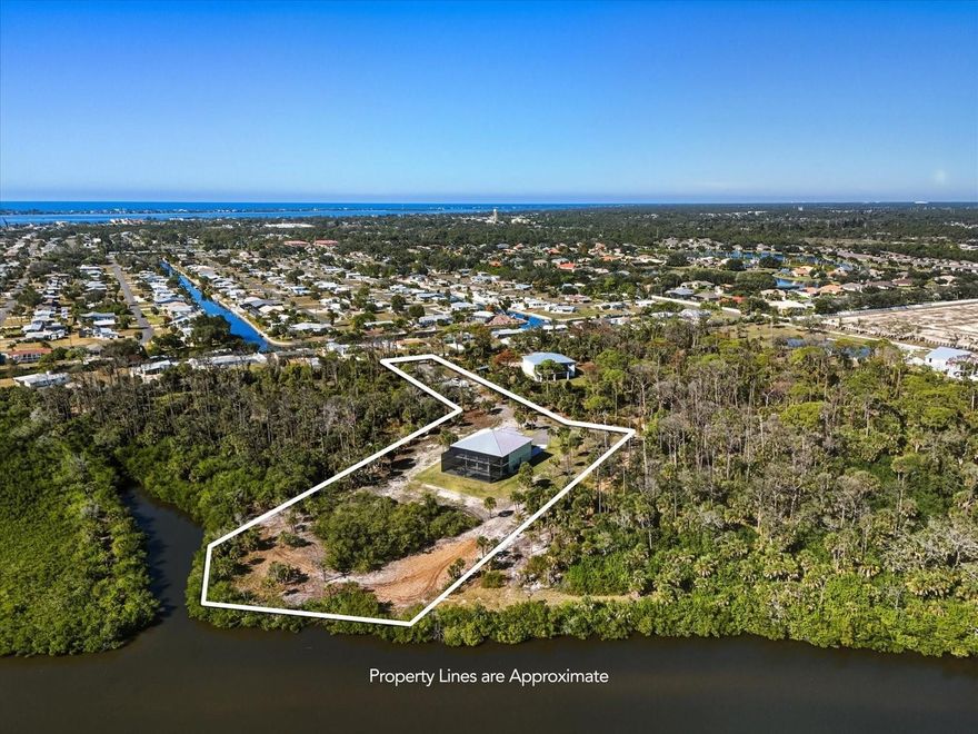 Welcome to an exceptional newly constructed 2025 waterfront estate offering a rare blend of luxury, land, and boating access. Situated on 2.50 acres along Rock Creek/Ainger Creek, this property delivers something almost unheard of—acreage with public water and public sewer, combining privacy and freedom with modern infrastructure. Site preparation included lot clearing and over 200 loads of fill, ensuring durability and elevation.
This two-story home showcases superior construction with a three-course stem wall, concrete block first-floor construction with smooth stucco inside and out, 2x6 second-floor framing, Hardie Board siding and soffits, aluminum railings, and a 24-gauge standing seam metal roof. Impact protection includes PGT vinyl impact windows, doors, and sliders, along with Clopay insulated impact garage doors. A designated cut-out with doors from the first-floor garage to the second-floor living area provides buyers the option to install an elevator or dumbwaiter.
Inside, the home features 4 bedrooms, 3.5 bathrooms, and a split floor plan offering privacy for bedrooms while maintaining an open-concept living, dining, and kitchen area—perfect for entertaining. Tray and vaulted ceilings enhance light and volume throughout. The first floor features epoxy flooring, while the second floor has luxury vinyl plank. The kitchen is finished with quartz countertops and backsplash, GE appliances, and a 36” six-burner gas range. Kohler fixtures are throughout, with ClosetMaid organizers in all bedroom closets and wire shelving in pantries, laundry, and bathrooms.
Efficiency and comfort include open-cell spray foam insulation, R-11 sound insulation in interior walls, vapor-shielded concrete walls, 400-amp electrical service, a 500-gallon propane tank, Rinnai tankless water heater, water softener, reverse-osmosis drinking system, PEX and PVC plumbing, and LED lighting inside and out. Climate control features a 4-ton Trane HVAC system with advanced air filtration upstairs and a two-head Daikin mini-split downstairs.
Outdoor living rivals a private resort with porcelain-tiled balconies, entry porch, and second-floor lanai, all enclosed below with wood and stucco finishes. The impressive two-story Mansford screened enclosure features picture windows and no-see-um screens, overlooking a gunite saltwater pool and spa with Pentair equipment, heater, and chiller. The expansive concrete pool deck offers sun and shade, ideal for entertaining and relaxing.
Boaters will appreciate the ability to add a private dock and boat lift, with calm creek access to Lemon Bay and the Gulf. Enjoy being just a 12-minute boat ride to the Placida Road boat launch, making waterfront adventures effortless.
A standout feature is the four-car garage fully under air, offering flexibility. Behind the garage is a large bonus room with full bathroom and direct access to the lanai and pool—ideal for an in-law suite, entertainment space, gym, or additional bedrooms. The property is zoned to allow two single-family homes, with the option to build a second residence across from the main home—an incredible opportunity for multigenerational living or future investment. Sellers are also installing a private irrigation well.
Despite the serene setting, the home is minutes from Englewood and Boca Grande beaches, downtown Englewood, shopping, dining, and medical facilities. Enjoy waterfront acreage living without sacrificing convenience—this is Florida luxury at its finest.