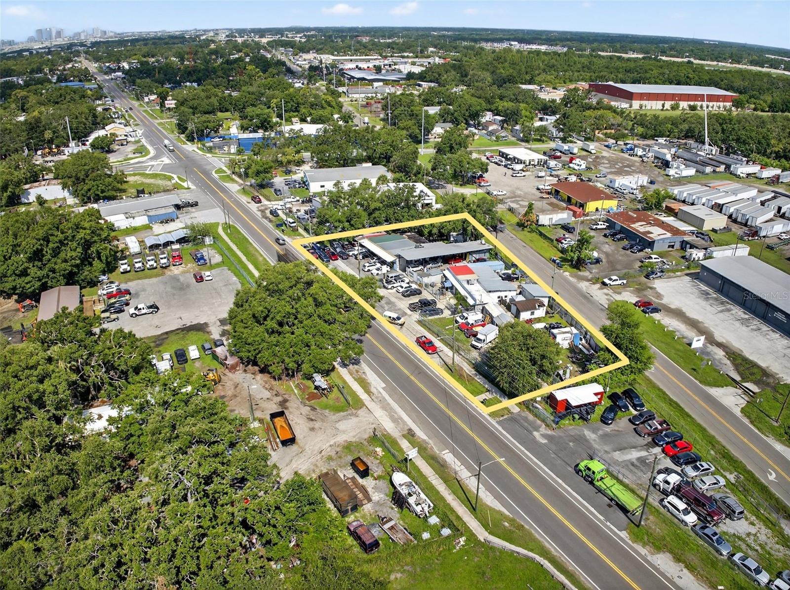 Welcome to this prime commercial opportunity located in the heart of East Tampa! This versatile 4,828 square foot building sits on a 0.26-acre lot and is currently operating as an auto repair facility, offering immediate functionality for owner-users or strong income potential for investors. Zoned for commercial use, the property features ample parking and yard space ideal for vehicle storage, display, or future expansion. What sets this opportunity apart is that it spans across three separate parcels, creating flexibility for future development, resale, or additional income streams. One of the units is currently leased to an auto repair tenant generating monthly income, while the adjacent paint store is owner-operated and may be available for sale as a business, offering even more potential for the right buyer. Situated on a high-traffic corridor with excellent visibility and easy access to I-4, I-75, and downtown Tampa, this location is well-suited for automotive, retail, light industrial, or service-based businesses. The surrounding area is densely populated and rapidly growing! Whether you're looking to expand your business, invest in a strategic location, or explore redevelopment possibilities, this property offers endless potential in one of Tampa’s most active commercial corridors. ADDITIONAL LOTS included for purchase are, 6304 E Broadway .14 acres AND 6245 E Columbus .18 acres