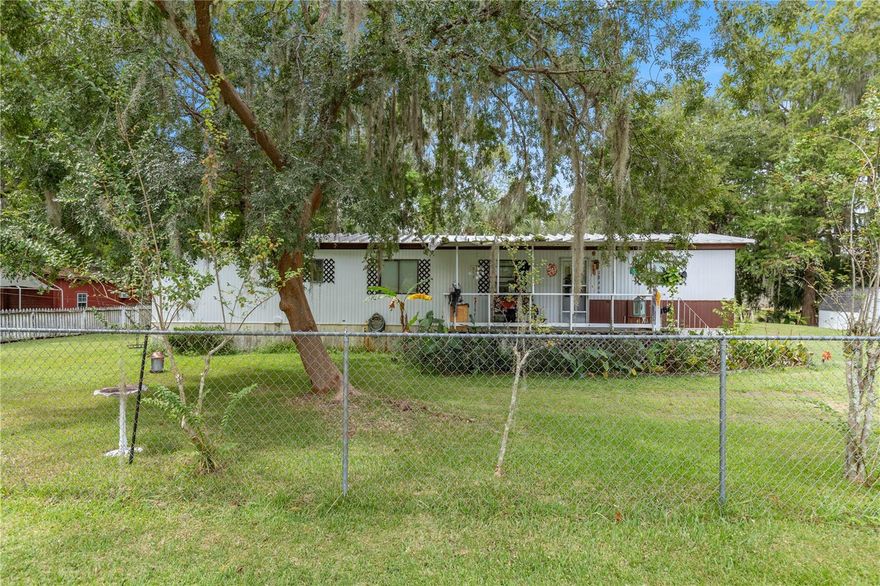 Discover this charming 2-bedroom, 1-bath abode, a hidden treasure nestled beside a picturesque canal that leads to the tranquil waters of Orange Lake. Ideally situated for an easy commute to Ocala and Gainesville, this property harmonizes tranquility with accessibility.
Embrace the convenience of residing near a canal, facilitating effortless access to Heagy-Burry Park for boating, fishing, and serene waterside relaxation. Encompassing approximately 0.31 acres, the property is securely enclosed by a chain-link fence, ensuring both safety and privacy.
Whether seeking a year-round dwelling or a weekend retreat, this home presents a unique fusion of waterfront living and proximity to urban amenities. Don't let this opportunity slip away—seize the chance to claim this property and indulge in a lifestyle that combines waterfront serenity with city convenience.