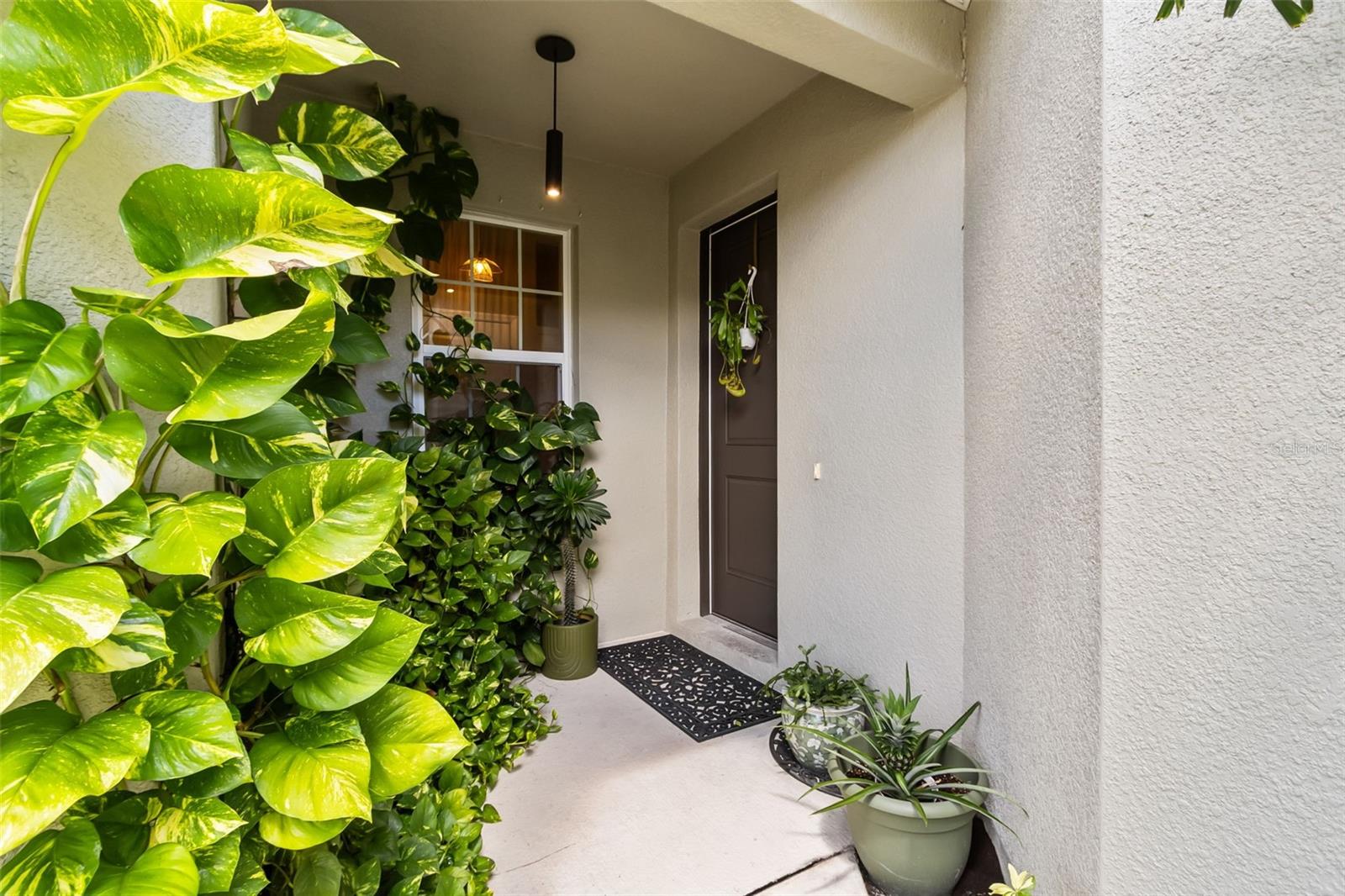 Live in the heart of Pinellas County — high and dry in a NO FLOOD ZONE — in this 2022 built luxury townhome. Located in a gated community this home isn’t just “better than new” it’s loaded with upgrades you won’t find in builder models, and it’s priced well under $500k.
From the moment you walk up the beautifully landscaped private entry, you’ll feel the care and quality that went into every detail. The certified energy efficient design includes a gourmet kitchen with Whirlpool stainless steel appliances, high-end quartz countertops, and solid wood cabinets. A brand-new water softener and reverse osmosis system give you pure, soft water throughout.
The open layout is perfect for entertaining, whether you’re gathered around the custom built-in electric fireplace or extending the party out to the screened-in lanai with marine-grade ceiling fan and elegant tile.
Your primary suite is conveniently on the main level, with dual closets, gorgeous tile flooring, and a spa-like en suite featuring a dual vanity, custom shelving, and luxury finishes. Upstairs you’ll find two more bedrooms, a full bath, and a versatile loft — ideal for a home office, playroom, or flex space.
The garage is a showpiece itself, with premium Integrity Coating floors that outperform traditional epoxy.
A two-zone thermostat keeps you comfortable year-round, and the home is built to the newest hurricane standards for peace of mind.
Bring your large dogs! This community offers a sparkling pool, clubhouse, and green space — all with minimal size/breed restrictions.
And the location? Unbeatable. 10 minutes to downtown St. Pete, 15 minutes to St. Pete Beach, 20 minutes to Tampa International Airport & MacDill AFB
You’ll be within reach to it all — beaches, restaurants, shopping, arts, and entertainment right at your fingertips.