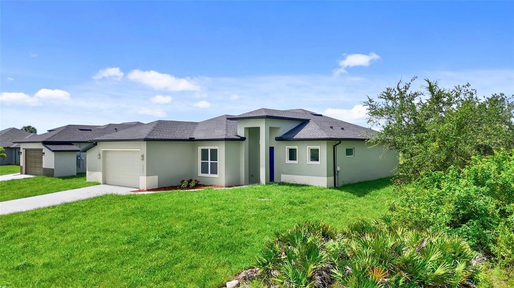 Photo of 13647 Begonia Circle, Port Charlotte, FL 33981 (MLS # O6371721)