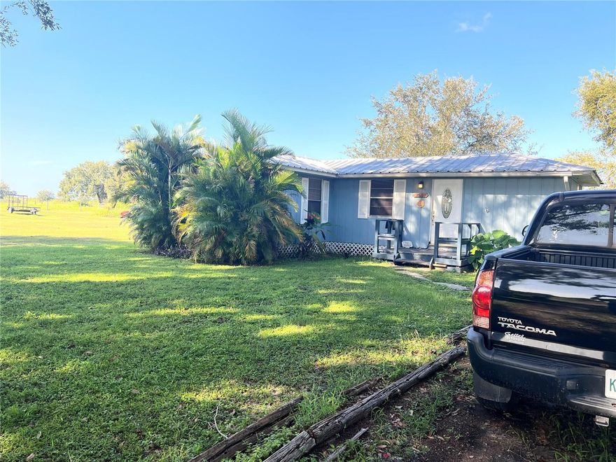 Adorable 2/1 house on 2.5 acres looking for it's new occupants! Barn, shed, 2 stables and outdoor bar included.