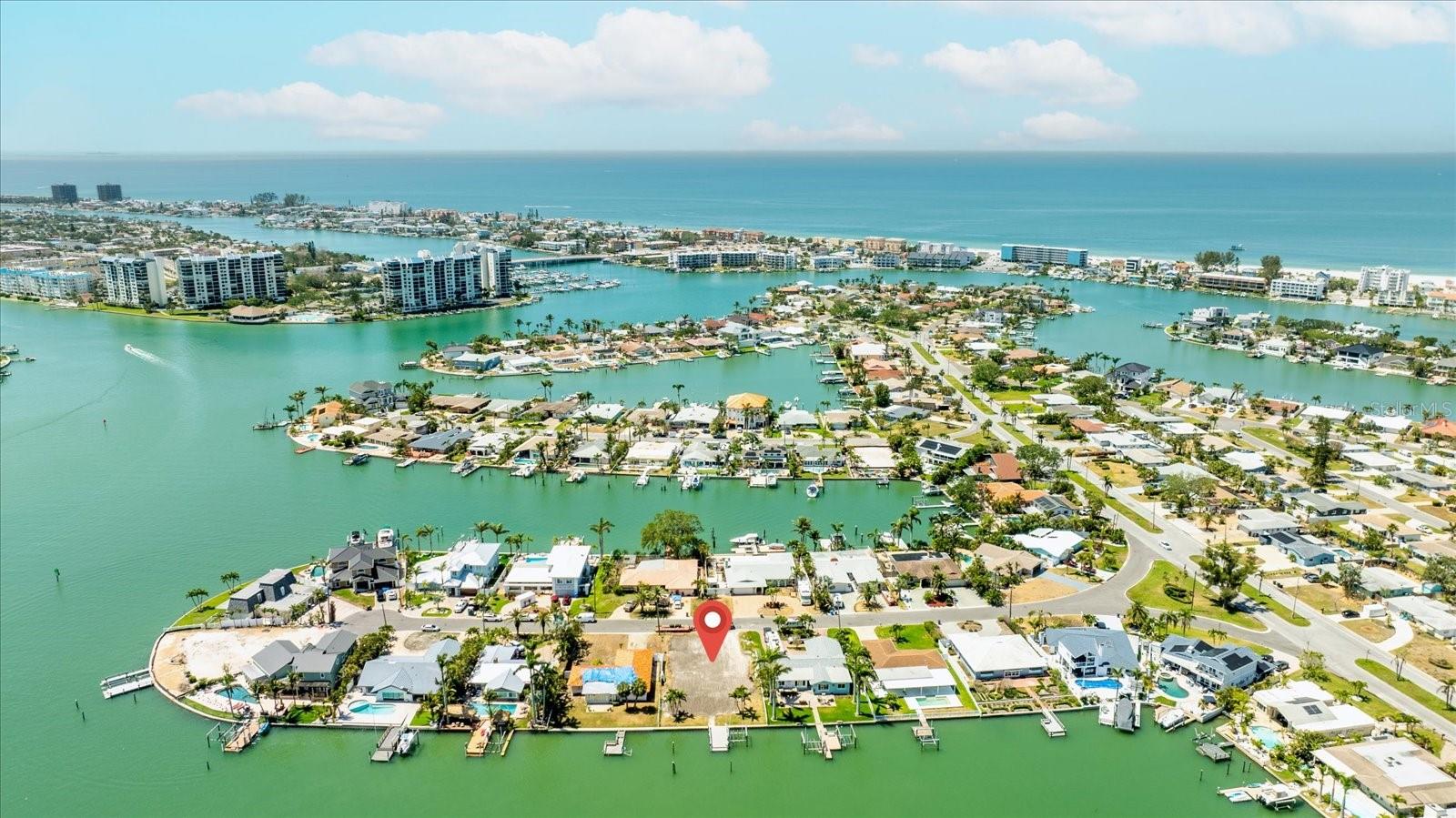 Build Your Dream Home on Paradise Island – A Premier Waterfront Opportunity!
Welcome to Paradise Island, one of the most desirable waterfront neighborhoods in all of Pinellas County! This exceptional property offers a rare opportunity to own prime real estate just 1.5 miles from the pristine sands of Treasure Island Beach, only 3 miles to vibrant John’s Pass Village, and minutes from the cultural heart of Downtown St. Pete.
Nestled on a wide, deep-water canal with no fixed bridges and direct access to the Gulf of Mexico, this lot is a true boater’s paradise. The property features 75 feet of seawall, a spacious dock, a 10,000 lb boat lift, and a wet slip ideal for accommodating a larger vessel.
Whether you’re an avid fisherman, sunset cruiser, or weekend sandbar hopper, this location puts you at the center of it all—easy boating access to waterfront restaurants, hidden coves, barrier islands, and some of the best beaches in Florida.
The owner has a Full set of signed architectural plans including elevations, floor plans, and engineering. The Soil boring and samples to determine foundation engineering requirements are completed. Build your custom dream home here and enjoy the ultimate Florida lifestyle on the water.