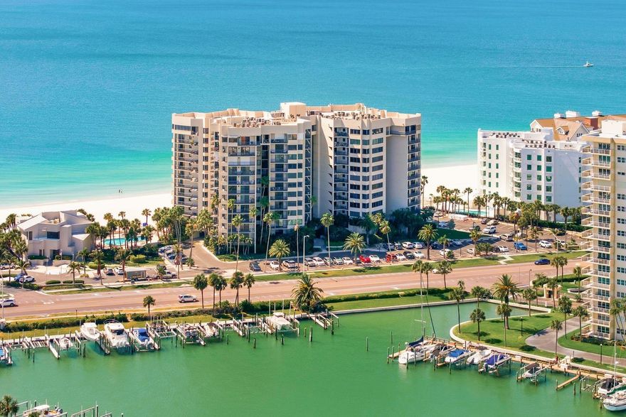 Welcome to coastal living at its finest — an exquisite beachfront condo nestled along the pristine shores of Sand Key, where the sugar sand meets the sparkling Gulf waters just steps from your door.

This beautifully updated two-bedroom, two-bathroom residence spans an impressive 1,880 square feet of thoughtfully designed living space, featuring a split floor plan perfect for both privacy and entertaining. Over $200,000 in upgrades elevate every inch of this home to a truly luxurious standard.

The stunning kitchen showcases new cabinetry, gleaming quartz countertops, and top-of-the-line appliances, flowing seamlessly into a breakfast area framed by breathtaking Intracoastal views. The spacious living room features a decorative fireplace that adds warmth and charm, while the formal dining room sets the stage for memorable gatherings.

The generous primary bedroom is a true retreat, complete with a private updated bathroom, quartz counters, a large walk-in closet, and a private balcony offering stunning water views. The guest bedroom is equally impressive, boasting its own balcony with water views and an updated bathroom with quartz countertops.

Brand new porcelain tile flows throughout, complemented by new hurricane-rated windows, custom shades, fresh interior paint, updated ceiling lights, and elegant five-inch baseboards. The family room opens to a welcoming balcony overlooking the water — an entertainer's dream.

Dan's Island offers Resort-style amenities include with 24/7 gated security, heated pool and spa overlooking the sandy beach, an outdoor grilling area, basketball/racquet ball court and a clubhouse with a fitness center, billiards room, full kitchen with wet bar great for entertaining.

Looking for boating options there are private boat slips across street for lease or purchase. 

Schedule your private showing today and discover the Clearwater Beach lifestyle you deserve.