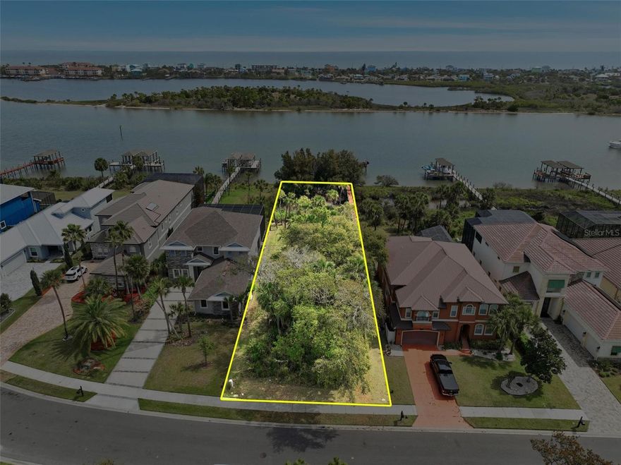 Now is your chance to purchase a waterfront lot and build your dream home in Palm Coast Plantation. Lot includes shared boat dock on intracoastal waterway. You just need to build your own boathouse. Lot is within this luxurious gated community that features gate, tennis, pickleball, pool, fitness, trails, boat ramp on lake, clubhouse and benches to enjoy the view of the intracoastal.