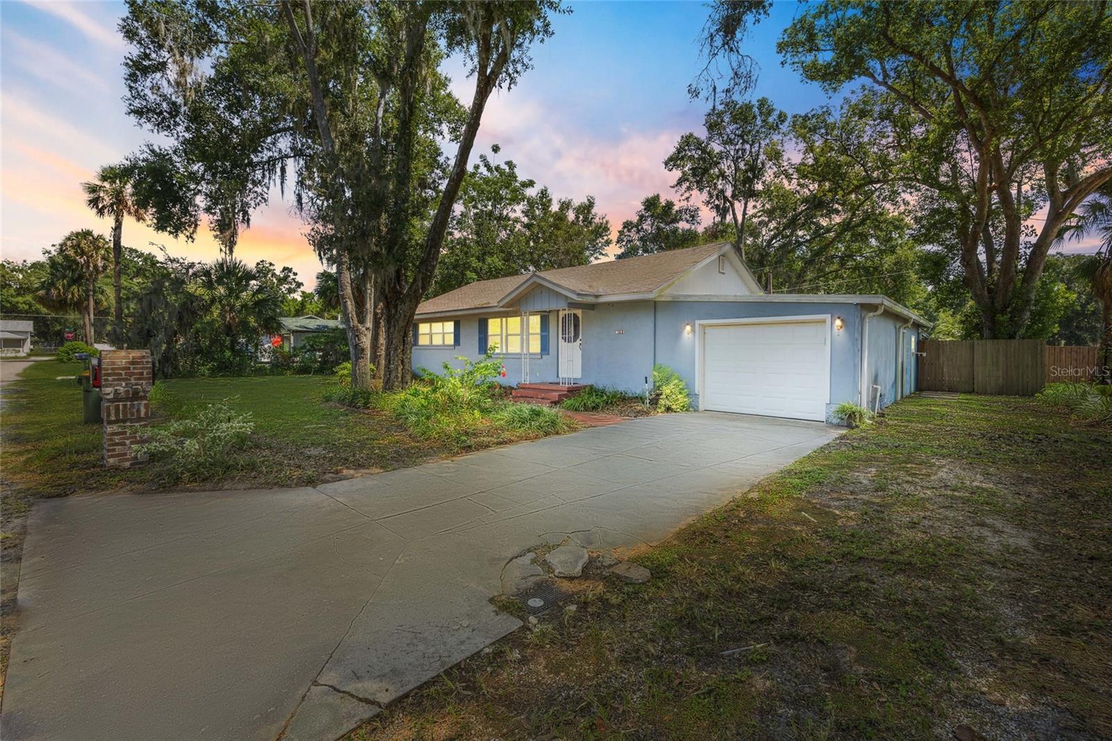 Welcome to 149 Palm Court, a charming 3-bedroom, 2-bath home tucked away on a peaceful dead-end street in the heart of downtown Umatilla. Less than a mile from City Hall, this home offers the ideal blend of privacy and convenience.
Recent updates include a new roof (2020) and new A/C system (2020), providing comfort and peace of mind for years ahead. Inside, you’ll find a bright and welcoming layout with spacious living areas and abundant natural light, designed for both everyday living and entertaining.
The fully fenced backyard is a true retreat that is perfect for relaxing, gardening, or letting pets roam freely. A large covered patio extends your living space outdoors, while the oversized one-car garage with built-in workbench and cabinets is ideal for hobbies, storage, or weekend projects.
With its thoughtful updates, inviting spaces, and unbeatable location, this home captures the best of small-town charm with modern convenience. Don’t miss your chance to make it yours - schedule a showing today!