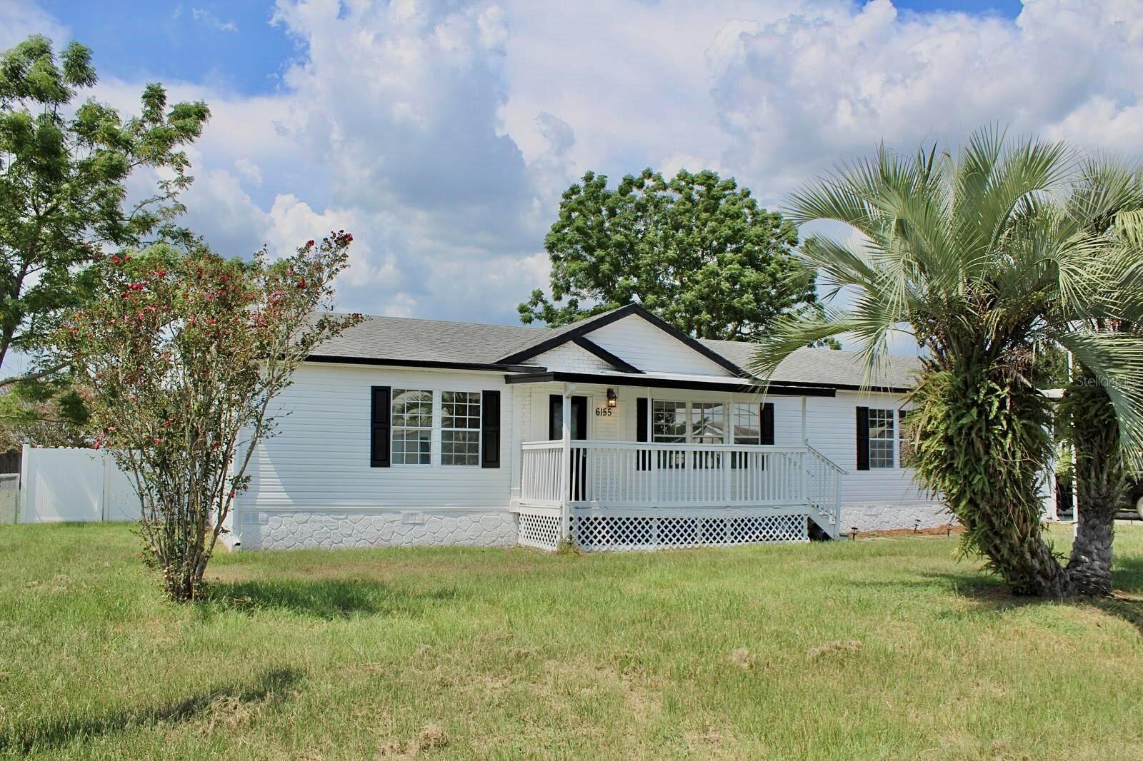 Charming mobile home located in Summerfield, FL, has a serene and peaceful setting. This cozy residence features an open floor plan with ample natural light, a spacious kitchen, and comfortable living areas. The property includes a generous lot with mature landscaping, providing plenty of outdoor space for relaxation and entertaining. Conveniently situated near local amenities and attractions, this home is a wonderful opportunity to enjoy a relaxed lifestyle.