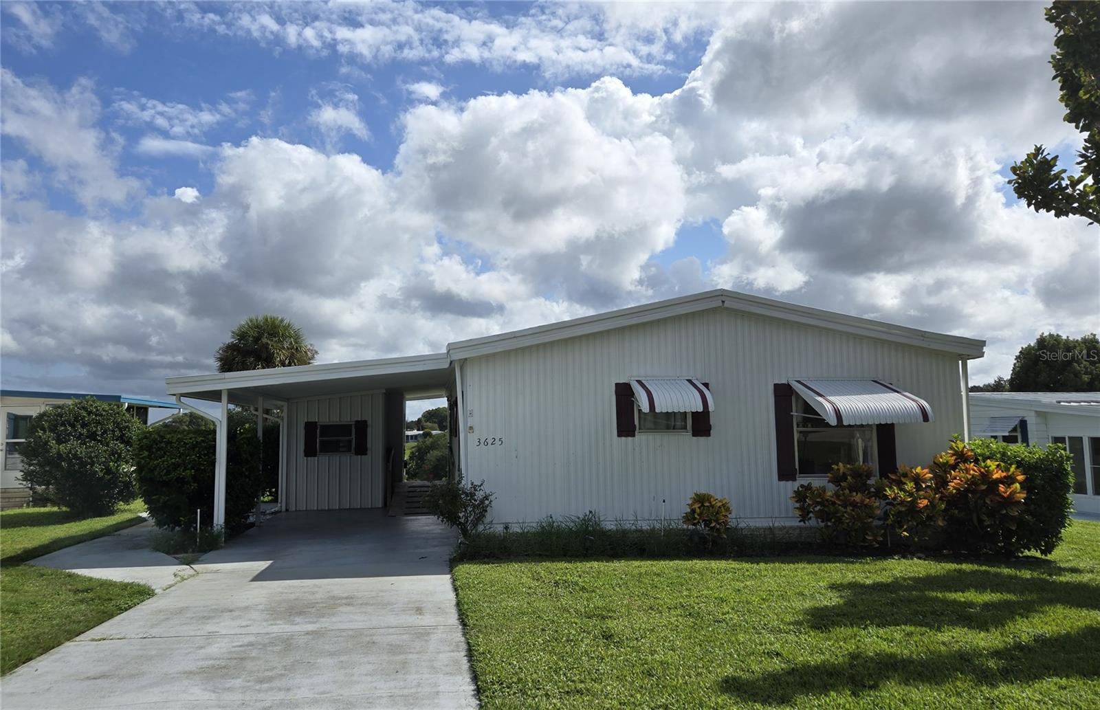 ZELLWOOD STATION 2 Bedroom 2 bath home located in Citrus Ridge. House has a beautiful view of the golf course and crater. Watch the golfers as you relax in your own home. House needs TLC and it will be a total gem. Versatile and open living and dining room space leaves room for imaginative arrangements. New A/C 2024. SELLER IS MOTIVATED, ALL OFFERS CONSIDERED. Zellwood Station is a Resident Owned 55+ Golfing Community located between Apopka and Mt Dora. We have a 72 Par golf course, 4 pools, pickleball and tennis courts; water exercise and line dancing classes and our own Whistle Stop Restaurant and Lounge with banquet facilities. There is always something to do here. Close to the 429 for easy access to airports and attractions, we are close to shopping, restaurants, medical facilities and churches. Come and see what we have to offer!