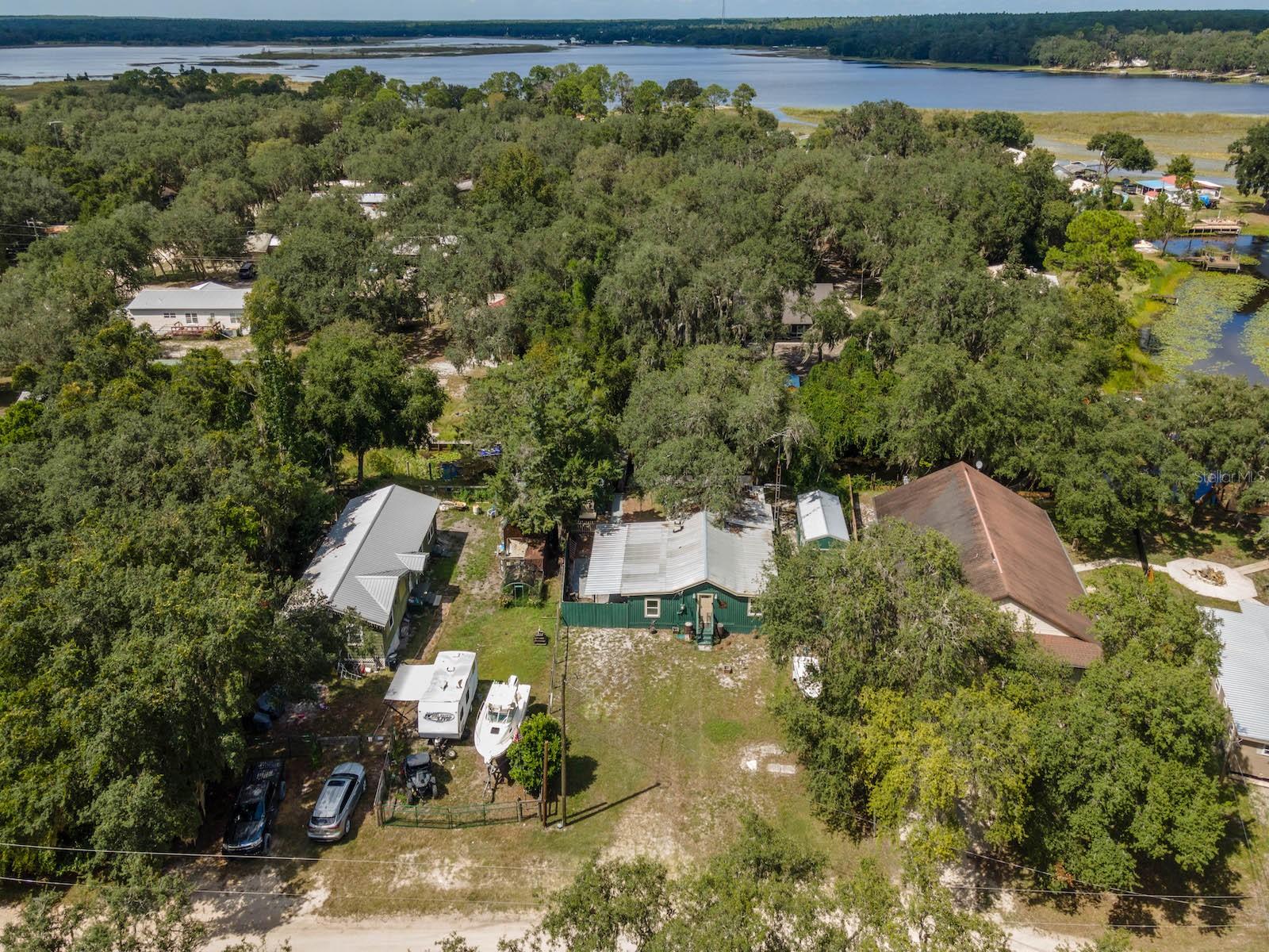 Located in the waterfront community of Kerr Shores, this beautifully updated home offers 85 feet of canal frontage with a short boat ride to Little Lake Kerr. The subdivision offers voluntary membership with access to a clubhouse, boat ramp, dock, and open acreage for family recreation.
Originally built in 1969, the home features 3 bedrooms, 1.5 bathrooms, and 1,342 sq ft of living space with a metal roof. Recent updates include all new flooring throughout, fully remodeled kitchen and bathrooms, new drywall and interior paint, fresh exterior paint, and new ceiling fans and light fixtures. The kitchen includes lots of cabinets, granite countertops, and a center island in addition to its modern updates.
The Florida room is full length along the back of the home, with waterfront views and a 14’x12’ screened room for enjoying the outdoors. A spacious 8’x31’ covered side porch adds to the outdoor living options.
The property also includes storage shed, a fenced side and backyard for privacy and security, and a dock for convenient boat parking.
Property Features:
.22 Acre Lot with 85’ Canal Frontage
3 Bedrooms | 1.5 Bathrooms | 1,342 Sq Ft
Florida Room with Waterfront Views
14’x12’ Screen Room + 8’x31’ Covered Porch
Recently Updated Interior with New Flooring, Paint, and Fixtures
Kitchen with Granite Countertops, Cabinets & Center Island
Private Dock with Direct Canal Access
Metal Roof | Built 1969
Located in the heart of the Ocala National Forest, this home is minutes from the Salt Springs Recreation Area, Lake George, and the St. Johns River. Salt Springs also offers miles of ATV, horseback, and hiking trails, excellent year-round fishing and hunting, and convenient shopping, dining, and services nearby. Only 30 minutes to Ocala or Palatka for additional shopping, dining, and entertainment.
This is a fantastic opportunity to own a move-in-ready waterfront home in one of Central Florida’s most scenic and recreation-rich areas.