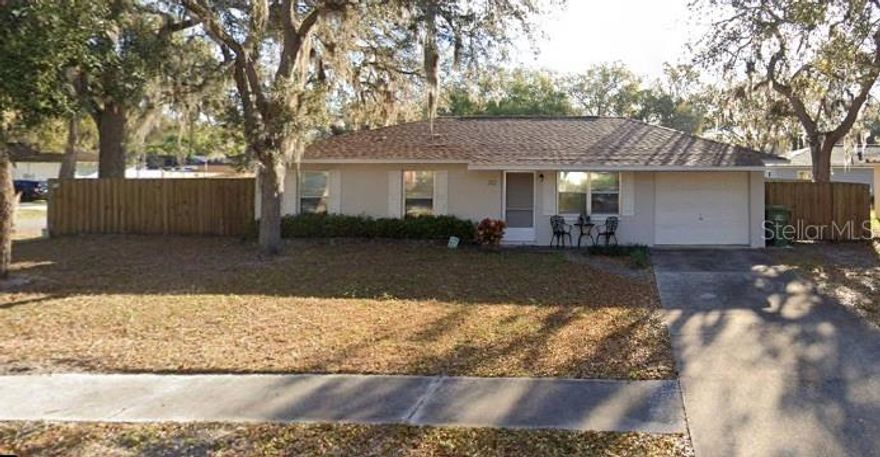 Don't miss this opportunity to own a beautiful home in Lake County with NO HOA! This home has great curb appeal as you pull into your driveway. It is on an oversized corner lot and NO HOA here! This is a 3 bedroom 1 bath home with a one car garage and a private fully fenced backyard for family play and gatherings! This home will be maintenance free for years to come with a NEW ROOF in July 2023, NEW STORM DOOR in July 2023, and a NEW CENTRAL AC/HEAT in July 2023 and A NEW HOT WATER HEATHER installed in 2026! Step inside the home and you will find luxury vinyl and tile- no carpet here. The home was freshly painted in 2023. The living room is bright and offers a storage closet. There is an open living dining concept and a well appointed kitchen with refrigerator, stove, dishwasher and microwave with plenty of counter space. You can watch children play from the kitchen window or enjoy the views of the backyard. The laundry is located in the garage for your convenience. The main bedroom is large with a walk in closet. You will find 2 more bedrooms and a full bath with new toilet in the hallway leading to the bedrooms. This home is perfect for a family looking for their first home or a retired couple looking to downsize and enjoy the Florida sunshine. The back yard is private and fully gated for your privacy. This home is only a few miles from The Villages, Downtown Main Street Leesburg, Close to Interstates and an hour from the Orlando theme parks. Take a look today! What a great place to call "HOME"!