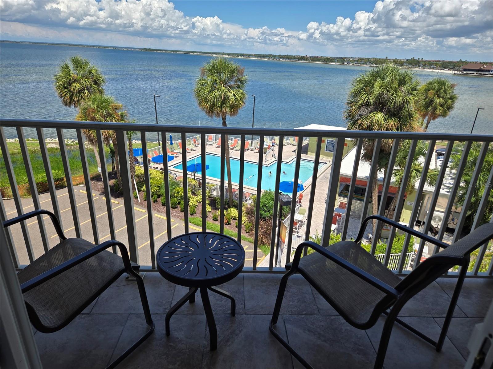 (HOA fees PAID thru 12/31/25)Fantastic opportunity to own this furnished-top(4th)floor-condo with water-views to the resort-style pool & the Tampa Bay Harbor. This "Pied-A-Terre" is great for getaways, primary residence OR a maintainable rental/income opportunity w/daily, weekly& monthly rentals. Open concept to the kitchen/living room area, access to the balcony w/great views. The monthly($793)HOA fee includes water ,sewer, garbage, basic cable & internet. Pets(1)welcomed, must provide ESA paper. Laundry facilities located on the 3rd floor. Sailport Waterfront Suites is a 238-unit boutique "condo/motel" building located on the SW tip of Rocky Point Island. This pedestrian friendly "exercise" resort offers:24/7 guard gate, BBQ area, sand volleyball, fire pit, sandy beach& a fantastic waterfront pool w/on-site restaurant & tiki bar. Minutes to Tampa International Airport, RayJay Stadium & the Ben T. Davis Beach & only 25mns to Historic Downtown St. Petersburg & the recently built $92-millon waterfront "St. Petersburg Pier", a 26-acre waterfront attraction w/over 2.6 million visitors annually. Maintained by the original owners since 1989. On-site property management, maintenace staff & a 24/7 Lobby w/a "Ship Store"!