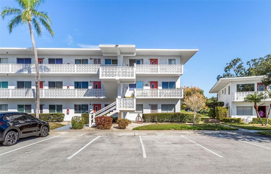 Welcome to your new home in the vibrant 55+ community of Seminole Gardens! Don't miss the opportunity to own this meticulously maintained 2BR/2BA corner unit condo situated on the 3rd floor with convenient elevator access. This end unit condo has a brand new HVAC and is fully furnished, offering both comfort and style. The kitchen is a chef's delight, equipped with ample cabinet space and a spacious built-in pantry. Enjoy your morning coffee or evening breeze in the enclosed balcony, boasting a picturesque canal view and accessible from the second bedroom. The master suite is a retreat in itself, featuring an en-suite bath and a generously sized walk-in closet. With over 900 sq ft of living space, this condo provides a cozy yet spacious atmosphere. Additional features include a storage closet within the unit, a storage locker, and same-floor community laundry conveniently located behind the elevator. Assigned parking is available, along with plenty of visitor parking for your guests. The prime location of this condo allows for a leisurely lifestyle, as it is just steps away from the year-round heated community pool and spa. Centrally located, you'll find Seminole City Center's shops, restaurants, and a movie theater nearby. Publix is a mere 2 minutes away, and the beautiful beaches are just a short 5-mile drive from your front door. Embrace the active 55+ community lifestyle with walking trails, shuffleboard courts, a shuttle service to local shops and banks, a bustling social calendar, and a clubhouse for gatherings. The monthly maintenance fee covers property taxes and the land lease fee, providing you with peace of mind. This condo offers a unique opportunity to experience the best of Seminole Gardens. Come see it today before it's gone! Your new home awaits, combining comfort, convenience, and community in one delightful package.