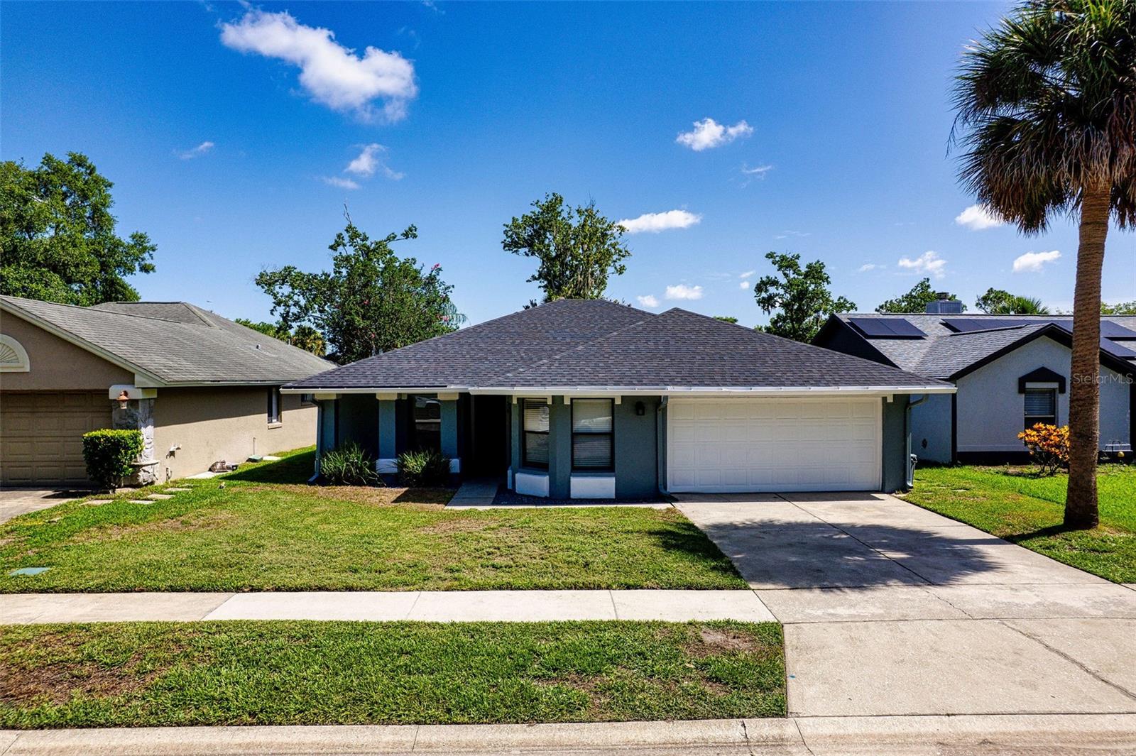 Hot Summer Savings! $250 off your first month's rent! Offer good until July 31, 2025! Just Remodeled 3-Bedroom Home in Lakewood at the Crossings – Available Now! Beautifully updated 3-bedroom, 2-bath split-plan home located in the desirable Lakewood at the Crossings community in Lake Mary. Featuring a spacious layout and fresh renovations throughout, this home is move-in ready and perfectly situated near top-rated Lake Mary schools, I-4, and a variety of shopping and dining options.
Step into a bright and airy great room with vaulted ceilings, feature shelves, recessed lighting, and luxury vinyl plank flooring that flows throughout the main living areas. The eat-in kitchen offers a full appliance package, tile flooring, recessed lighting, and a convenient closet pantry. The master suite is a private retreat with LVP flooring, ceiling fan, a large walk-in closet, and an ensuite bath featuring a double vanity and a tub/shower combo. Two additional bedrooms also include LVP flooring, ceiling fans, and 2” blinds—ideal for family, guests, or a home office. Spacious, privacy-fenced backyard with open patio—perfect for relaxing or entertaining. A two-car garage completes the package. Renter’s insurance required. Available now—schedule your tour today!