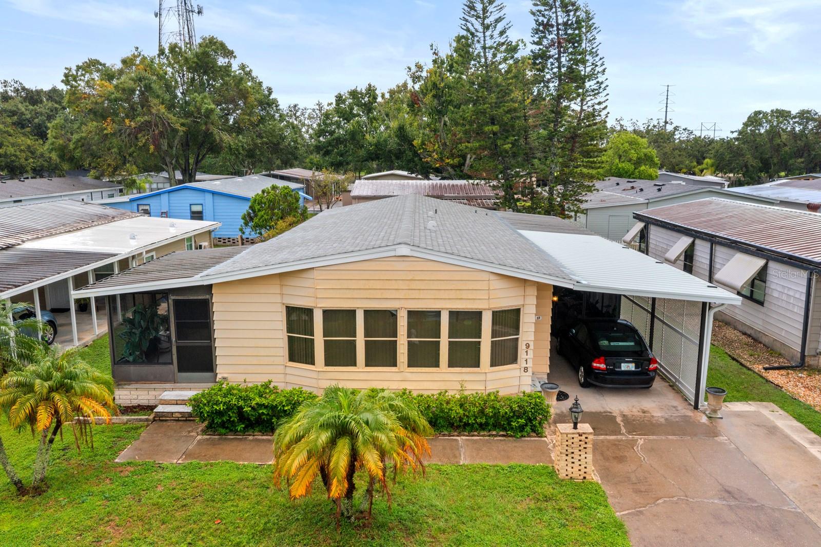 NO FLOOD ZONE. NO LOT RENT-YOU OWN THE LAND AND YOUR HOME-LOW HOA. Th This home is in the sought-after Sheldon West Community, known for its location near Westchase and Citrus Park area. It is a 55+, pet and golf cart friendly, well-maintained park, and it is a short walk to the Community Pool and the Club House. It is a true "turnkey" home offering 3 bedrooms and 2 bathrooms. See this furnished and beautifully decorated home with exclusive furniture from Galloways Furniture store. Newer Stainless steel refrigerator, range and microwave. You will find many upgrades including a newer Roof and AC. The open living-dining room and kitchen make an awesome place to entertain your family and friends. The large Florida room is wonderful for gathering for beautiful Florida Sunsets. You will feel the warm Florida Sunshine with all the natural lighting you will have as you enter the home. There is a large community pool and clubhouse, shuffleboard, and your community dock overlooking the lake to enjoy the SUNSETS. You will be close to shopping, restaurants, entertainment, Medical Centers, and more. This home is waiting for you. The property information provided here is for reference only and is not guaranteed to be accurate. It is the buyer's responsibility to verify all property information.