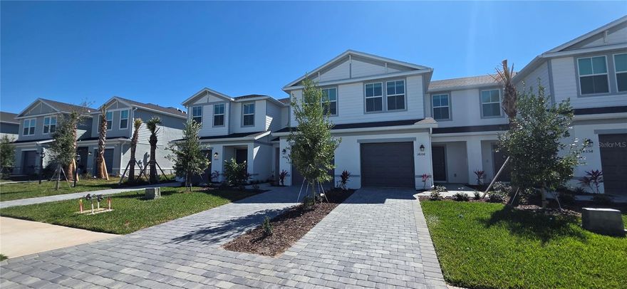 Live the Lakewood Ranch lifestyle in this beautifully upgraded Avery floor plan townhome by Lennar located in the highly desirable Aurora at Lakewood Ranch community.  This modern 3-bedroom, 2.5-bath townhome offers a spacious and thoughtfully designed layout with premium upgrades throughout and peaceful lake views from the home.  Inside, you’ll immediately notice the upgraded flooring and stylish stair railing, giving the home a more elevated and contemporary feel compared to standard builder finishes. The open-concept main living area provides the perfect space for relaxing or entertaining, seamlessly connecting the living room, dining area, and kitchen.  Large windows bring in plenty of natural light while offering beautiful views of the lake, creating a calm and inviting atmosphere.  Upstairs, the owner’s suite offers a comfortable retreat with a spacious bedroom, private bathroom, and generous closet space. Two additional bedrooms provide flexibility for guests, family, or a home office.  Located in Aurora at Lakewood Ranch, residents enjoy access to one of the nation’s top master-planned communities, with nearby parks, walking trails, shopping, dining, and top-rated schools just minutes away.  This home is perfect for anyone looking for modern construction, upgraded finishes, and scenic water views in one of the most desirable areas of Lakewood Ranch.