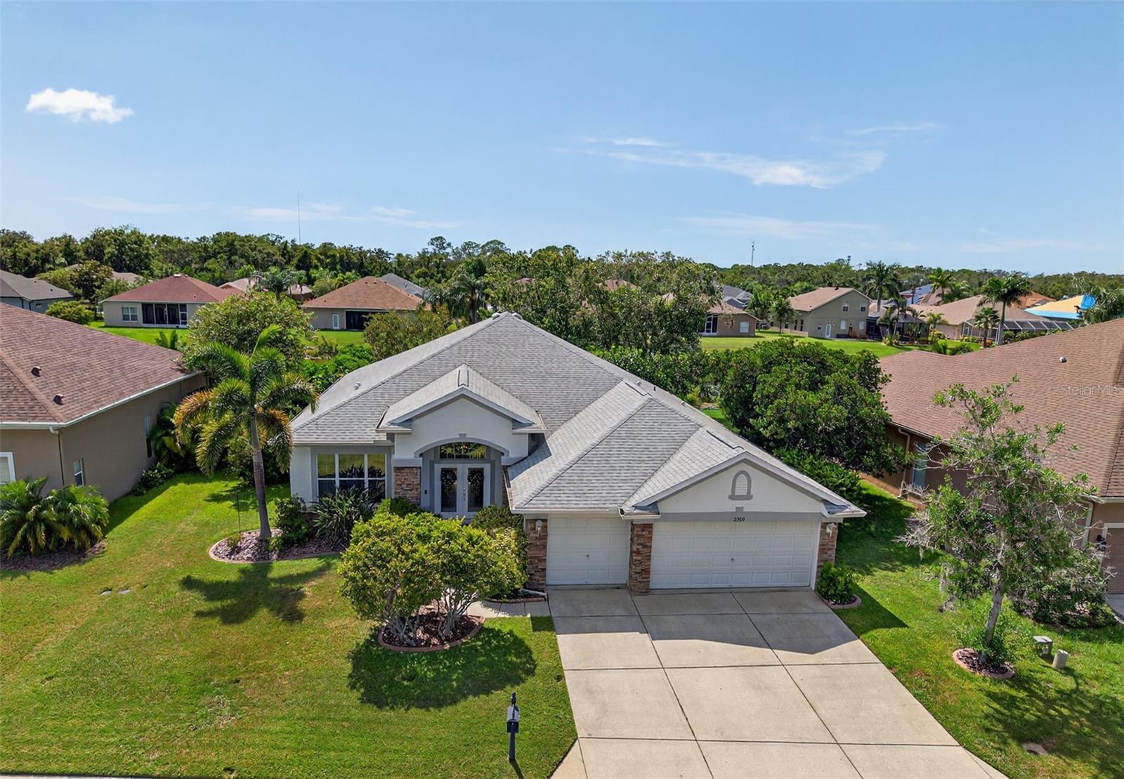 Stunning Lakefront Pool Home in Magnolia Estates, Trinity! Welcome to this beautiful 4 Bedroom plus Office, 3 Bath, 3 Car Garage Pool Home located in the highly desirable Gated Community of Magnolia Estates. Perfectly situated on a serene Lakefront lot, this home offers breathtaking views and a lifestyle of both comfort and elegance. Step inside to a spacious open layout with soaring ceilings and newer Luxury Vinyl Plank flooring throughout, combining modern style with lasting durability. The thoughtfully designed floor plan includes a Private Office, generously sized Bedrooms, and multiple living spaces that are ideal for both everyday living and entertaining. The heart of the home flows seamlessly to the outdoor living area, where a screened-in Pool and covered lanai overlook the tranquil lake, the perfect backdrop for morning coffee, evening sunsets, or weekend gatherings. This home also offers peace of mind with major updates already completed, including a newer Roof (2020), a newer HVAC system (2020), a newer Water Heater (2024) and upgraded Flooring. A spacious 3 Car Garage provides ample room for parking and storage. Residents of Magnolia Estates enjoy access to a private community boat ramp with direct access to the Anclote River, leading out to the Gulf of Mexico. Conveniently located near top-rated schools, shopping, dining, golf courses, and just a short drive to the area’s beautiful beaches, this home truly has it all! Don’t miss the opportunity to make this exceptional lakefront pool home yours! LET'S GET IT SOLD!!!
