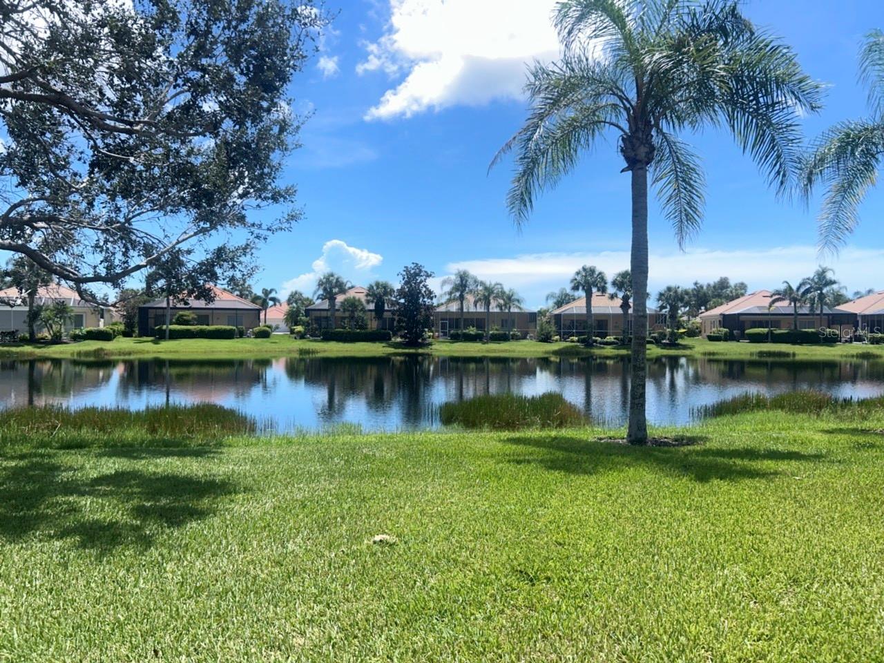 Best priced and valued 3 bedroom 2 bathroom at Islandwalk! Don't pass this property up, ready for new owners! Open floor plan with beautiful wood floors in the living area that opens up to a screened patio overlooking the pond.IslandWalk is one of VENICE'S most social communities with a FULL TIME ACTIVITIES DIRECTOR, countless events and clubs and activities, TWO community clubhouses, an EVENT center, TWO resort style pools, a LAP pool, 12 PICKLE BALL Courts, 8 Har Tru Tennis Courts, DOG PARK, Playground, Basketball Court, Community Garden- the list goes on! The entire community is surrounded by miles and miles of golf cart trails, walking and biking trails, VENETIAN bridges and water! The Atlanta Braves Stadium is a short bike ride away- enjoy year-round events and activities. The new marketplace is now complete with PUBLIX, restaurants, shopping, gas station, etc! Downtown Wellen Park features an 80-acre lake, retail shops, restaurant waterfront dining and rooftop decks, pedestrian-friendly streets, a splash pad, a playground and a public town hall gathering place that hosts live theater and music events. Coming soon to downtown Wellen Park- a hammock grove and a permanent food truck area IslandWalk HOA includes grounds maintenance, CABLE, WIFI, amenities, and 24 hour guard.