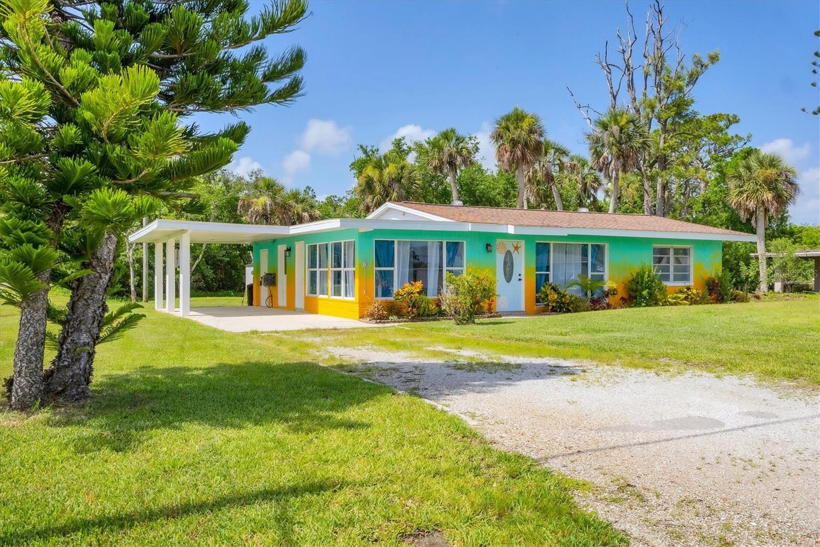 SELLER EXTREMELY MOTIVATED- ALL REASONABLE OFFERS WILL BE SERIOUSLY CONSIDERED! PRICED TO SELL AND READY FOR IMMEDIATE OCCUPANCY! SELLER IS FLEXIBLE AND LOOKING TO MAKE A DEAL! "FLOOD INSURANCE IS PROVIDED BY THE NATIONAL FLOOD INSURANCE PROGRAM AND IS TRANSFERABLE TO NEW OWNER" Rare opportunity in Venice with no HOA and a deeded boat slip offering direct access to a saltwater canal and open water. Situated on a spacious corner lot, this beautifully updated 3-bedroom, 2-bath concrete block home blends coastal charm with modern convenience. The property includes Lots 33 and 35A, providing extra space and flexibility. The kitchen has been fully renovated with all new appliances and waterproof soft-close cabinetry. Both bathrooms have been updated with stylish, contemporary finishes. Major systems have been upgraded with new plumbing and electrical, and all interior doors have been replaced. The home also features custom steel weatherproof exterior doors for added security and durability. Built with sturdy concrete block construction, the home is designed to withstand Florida’s climate. An exterior shed provides additional storage, while the artesian well offers an eco-conscious water source—perfect for those interested in sustainable living. The home has been freshly painted inside and out, with a modern gradient exterior. The private yard is lush and tropical, framed by mature palm trees, creating a peaceful outdoor space for relaxing or entertaining. Located just minutes from Myakka State Forest, this home also offers convenient access to shopping, dining, and beaches. Walk to the popular Tarpon Point Grill & Marina, or take a short drive to the Gulf coast. Ideal for boaters, nature lovers, or full-time residents seeking a move-in-ready home with character and charm.