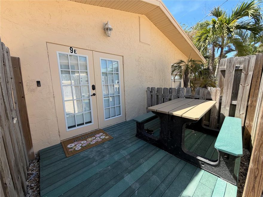 Discover this charming beachside condo just south of Venice in Englewood, Florida. Featuring elegant ceramic tile flooring throughout both units, this versatile property offers comfort, style, and flexibility.
Relax in your peaceful retreat or take a short stroll behind the units to unwind on the covered dock—perfect for enjoying your morning coffee in a serene setting.
The property includes two fully equipped kitchens with ranges, microwaves, refrigerators, and washer/dryers. The main unit boasts an open floor plan highlighted by a spacious granite countertop that flows seamlessly into the living area. It also offers two full-sized bedrooms and a full bathroom.
The secondary unit functions as a private suite, featuring a combined bedroom/living space, along with its own separate kitchen and bathroom. A locking door between the units allows you to use the property as one large home or split it into two independent living spaces—ideal for guests, rental income/Air BnB, or multi-generational living.  The main unit is currently being used as an Air BnB.