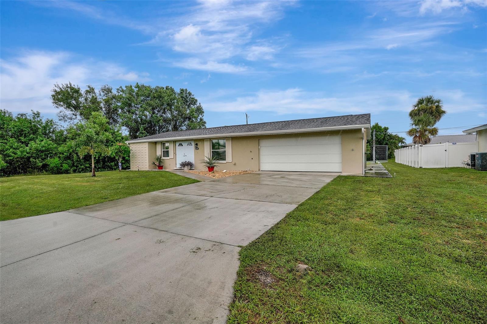 Welcome to the perfect blend of comfort, style, and Florida living! This beautiful one-story home offers 1,389 sq. ft. under air and is brimming with charm from the moment you arrive. The inviting curb appeal draws you in, and the warm, open layout makes you instantly feel at home. Whether you’re looking for a winter retreat or a year-round haven, this home is ready to wrap you in comfort. Step inside and discover a spacious floor plan where the light-filled living room connects seamlessly to the kitchen—perfect for gatherings and everyday living. The oversized two-car garage provides excellent storage space. The master suite is a retreat, offering room for your favorite furnishings and an updated master bath. Two additional bedrooms provide cheerful natural light and versatility for guests, family, or a home office. Enjoy a huge backyard oasis complete with an above-ground pool and a fabulous covered and screened lanai, offering plenty of privacy for morning coffee or evening sunsets. With no carpet anywhere, a new A/C, and a newer hot water tank and new plumbing, you can move right in and start enjoying your florida life. This home has it all—location and a price that makes it an incredible find. Don’t miss the chance to make it yours—schedule your private showing today!