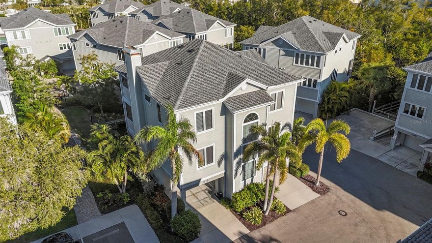 Wow, New Price! Experience the ultimate island lifestyle in this masterfully renovated 2,880 sqft living space / 4 Bed/ 3 Bath / 3 Car Garage Elevated sanctuary on the tranquil north end of Longboat Key. Offering the expansive feel of a single-family residence with the effortless "lock-and-leave" ease of being in the beautiful condo community of Cedars Tennis Resortand Club. This esquist 4BR/3BA retreat defines coastal chic. A private elevator serves all three levels, opening into a sun-drenched great room with soaring ceilings, a fireplace, and a gourmet kitchen featuring dual islands and designer finishes. The refined dining room opens right off of this space with its custom built-in cabinetry and dry bar, ideal for any social gathering. Relax on your private, screened lanais overlooking lush tropical foliage and serene ponds, with peek-a-boo views of the Gulf. There is one on each living level. Rounding out the main living area is a versatile den/office (currently used as the 4th bedroom), a full third bathroom, beautiful hardwood floors throughout and a dedicated laundry room. The primary suite is a true oasis with a spa-inspired sunken bath, large walk-in shower and dual vanities and walk-in closets. Upstairs beyond the oasis of a primary there are two additional oversized guest bedrooms and a beautifully renovated guest bathroom with walk-in shower. Recent updates beyond the full renovation of the interior include 2026 Garage door replacements, 2024 roof and AC replacement. Hardi- Board siding on exterior and Pella high-impact windows. The split 3-car garage provides total peace of mind and the rare abundance of space and storage. Nestled in the 66-acre village-like townhome community that is enveloped by nature, providing effortless access to both the beach and the bay on the beautiful north end of Longboat Key. The spacious and tropical community features lit boardwalks winding through mangroves, leading to an array of exceptional amenities including a heated Jr. Olympic Size Pool, nine Har-Tru Tennis Courts, three Pickleball courts, a Clubhouse with a Pro-Shop, a 24-hour Fitness Center, a Tiki bar, a restaurant, a fishing pier, and a kayak launch. Please note that some amenities require an additional club membership. The property is within walking distance to a variety of local attractions, such as Harry's Deli & Continental Kitchen, the true island gem that is Joan Durante Park, Euphemia Haye Restaurant & The Haye Loft, and, of course, Longboat Key's globally renowned sugary white sand beaches. Furthermore, it offers convenient proximity to other major attractions and cultural venues, including St. Armand's Circle, Mote Aquarium, the Asolo Repertory Theatre, Van Zel Performing Arts Center, Marie Selby Gardens, Anna Maria Island, the Ringling Museum complex, and numerous dining options on Longboat Key and in downtown Sarasota. Cedars East is the rare community on LBK that offers shorter term rental allowance with its 2 week minimum allowance it's the perfect balance of offset cost when not in use while not living in a hotel community. Exceptional onsite management in place if desired. Fantastic residence, rare opportunity, come take a look today