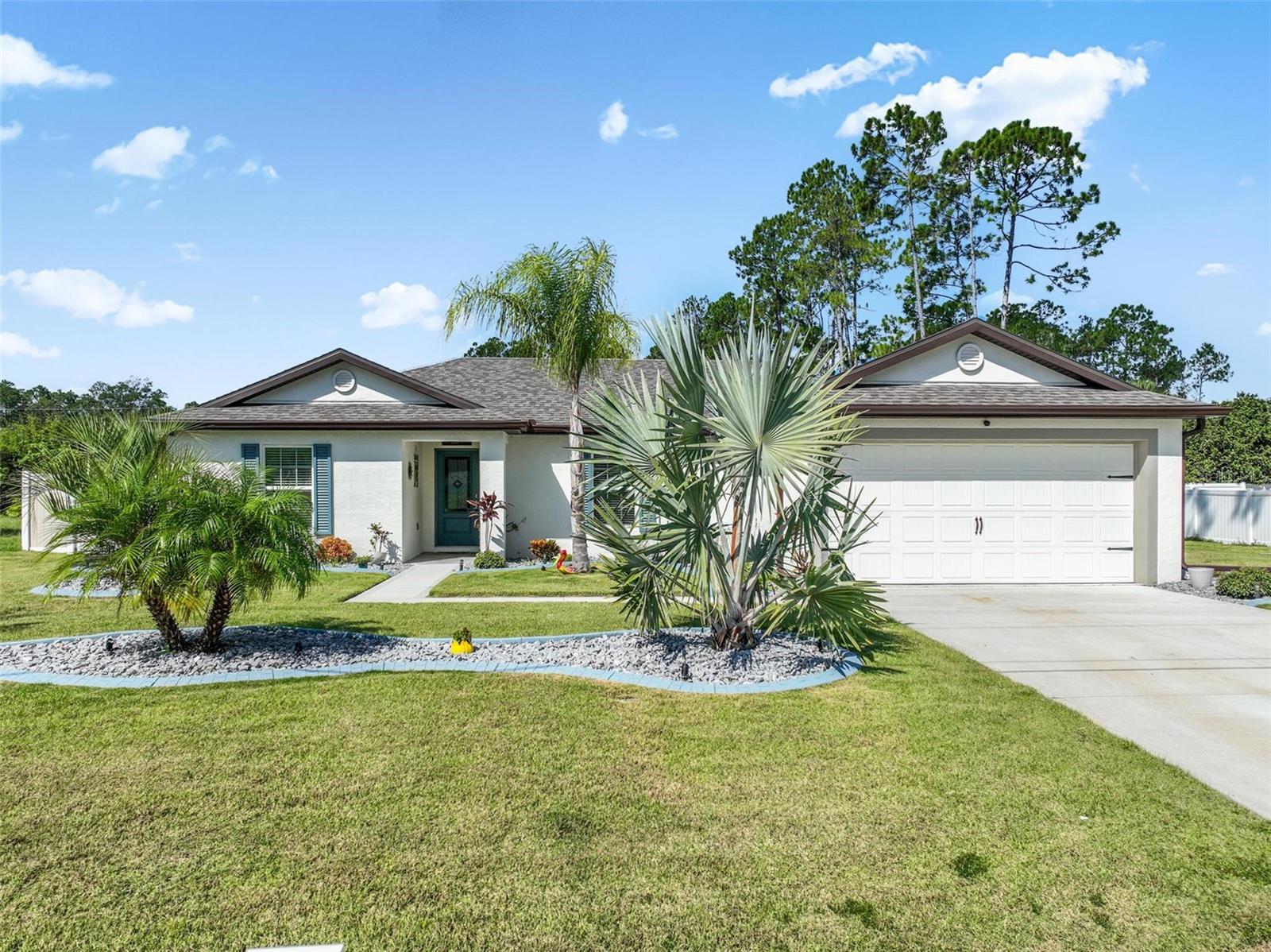 Why wait to build when you can move right into this beautiful 3-bedroom, 2-bathroom block home that’s less than 2 years old? Thoughtfully upgraded inside and out, this home offers the ease of new construction with the bonus of owner-added improvements you won’t find in the standard models.
Step inside to a bright, open layout that makes entertaining and everyday living a breeze. The heart of the home flows seamlessly, giving you plenty of space to relax or host family and friends.
Outside is where this property really shines! The seller has already invested in a vinyl privacy fence, gutters, and professional landscaping that adds curb appeal and charm you’ll notice the moment you pull up.
All the hard work has been done for you—just bring your furniture and start enjoying Florida living at its best!