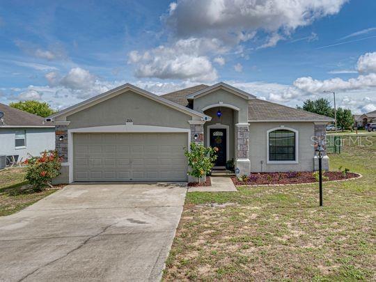 HOME SWEET HOME!!! Come see this immaculate and cozy home for yourself. Walk in to a spacious and open floor plan. The kitchen overlooks the family room that has sliding glass doors that lead to the fenced back yard. 3 spacious bedrooms with ample closet space and 2 full bathrooms, as well as a 2-car garage. This home sits on a corner lot in the lovely community of Dinner Lake Shores in Lake Wales, FL. Beautiful matching ceramic tile throughout the main living area and a New Central A/C Unit with a 12-year Warranty, installed in January 2023. This Home is a must see, Schedule Your Tour Today!!!